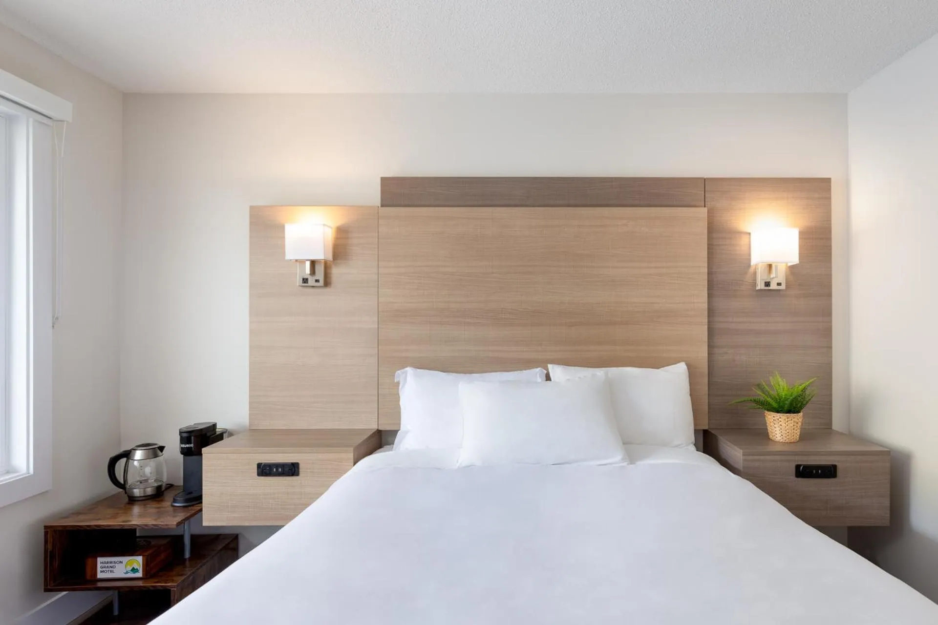 Bed in Harrison Grand Motel