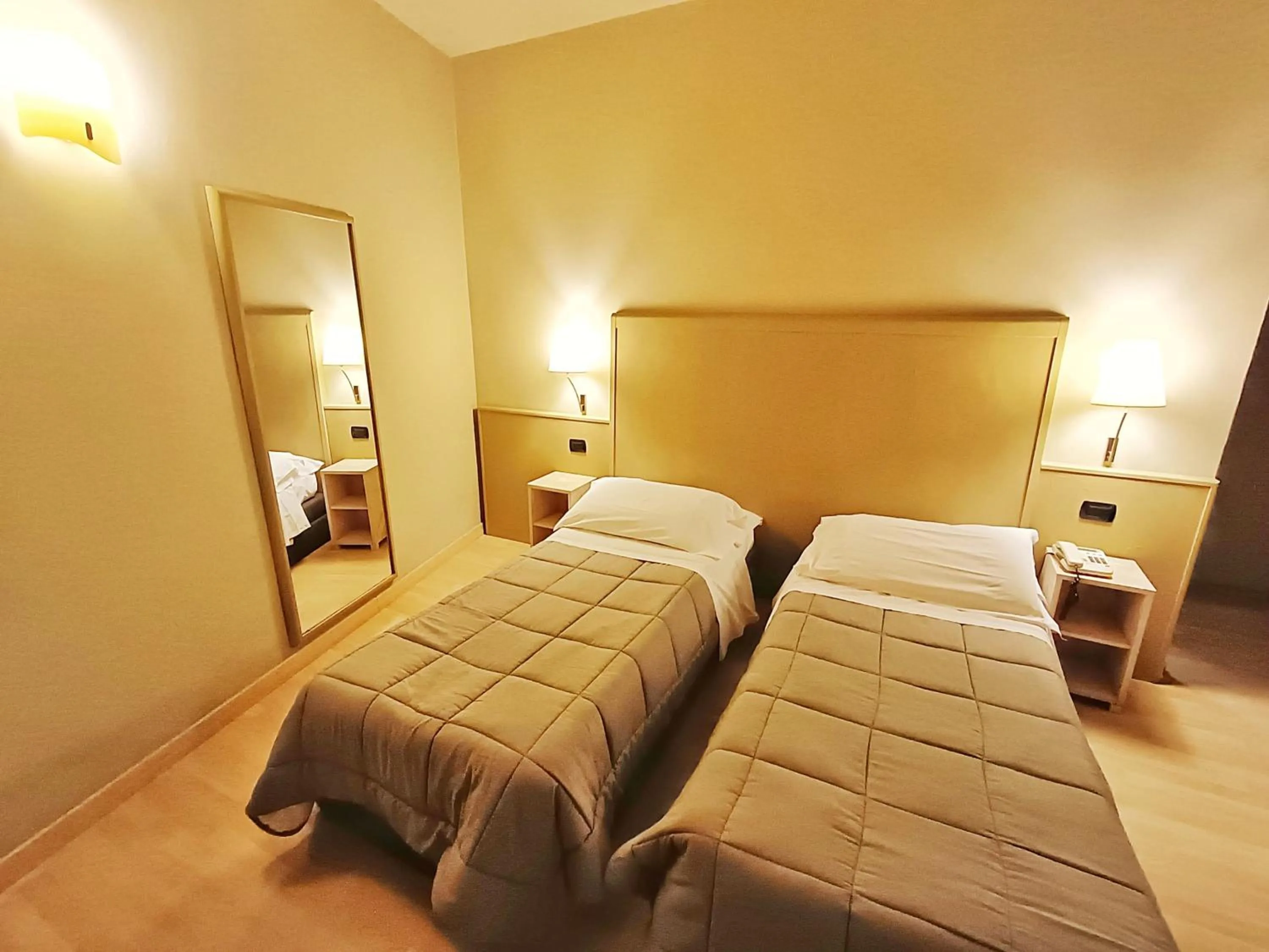 Bed in Hotel Corallo Rimini