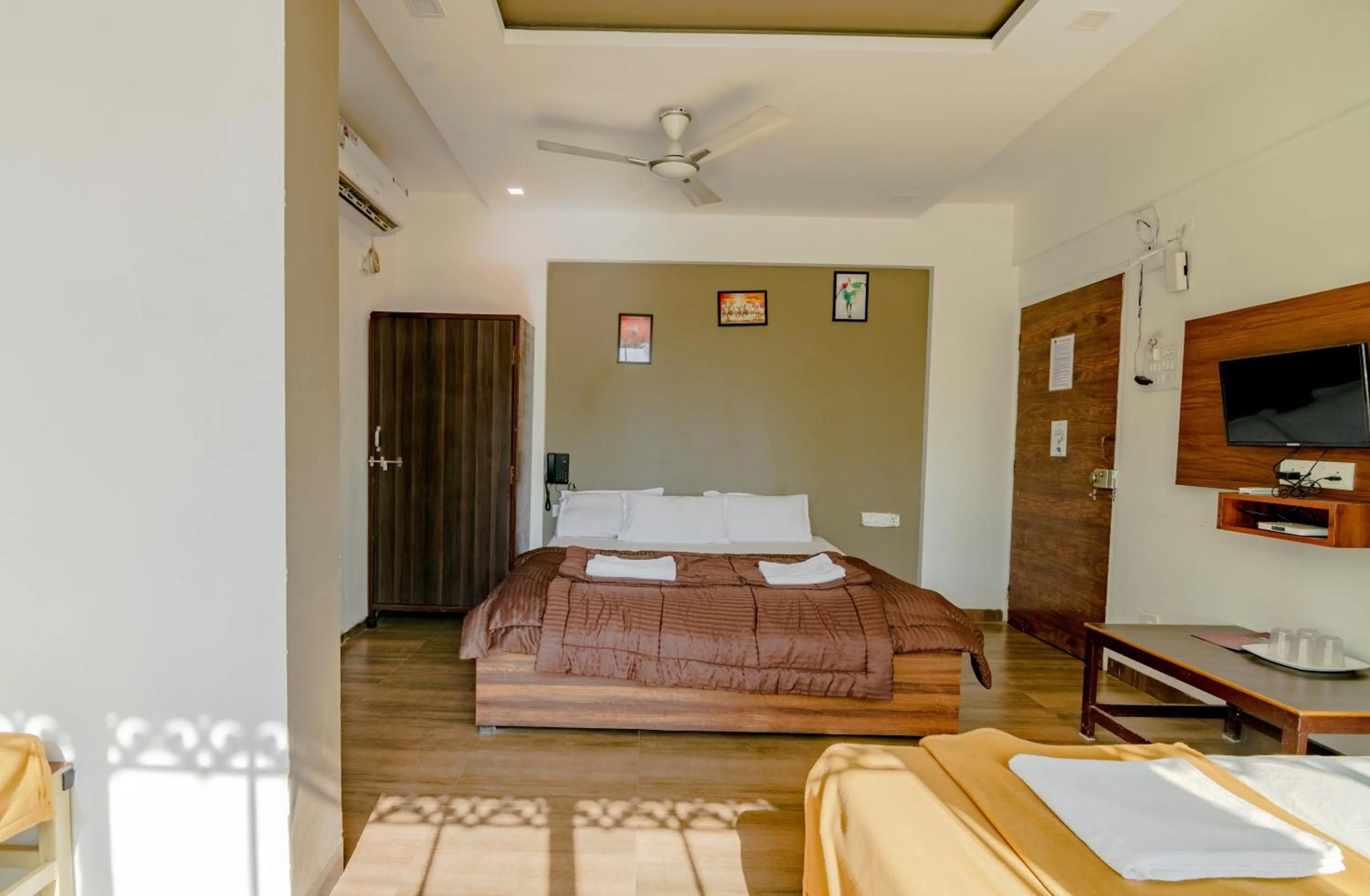 Bed in White House Beach Resort, Nagaon