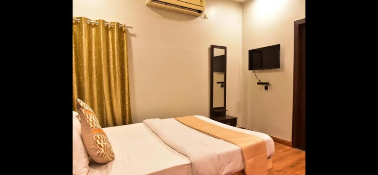 Bed in HOTEL MITTAL GARDEN