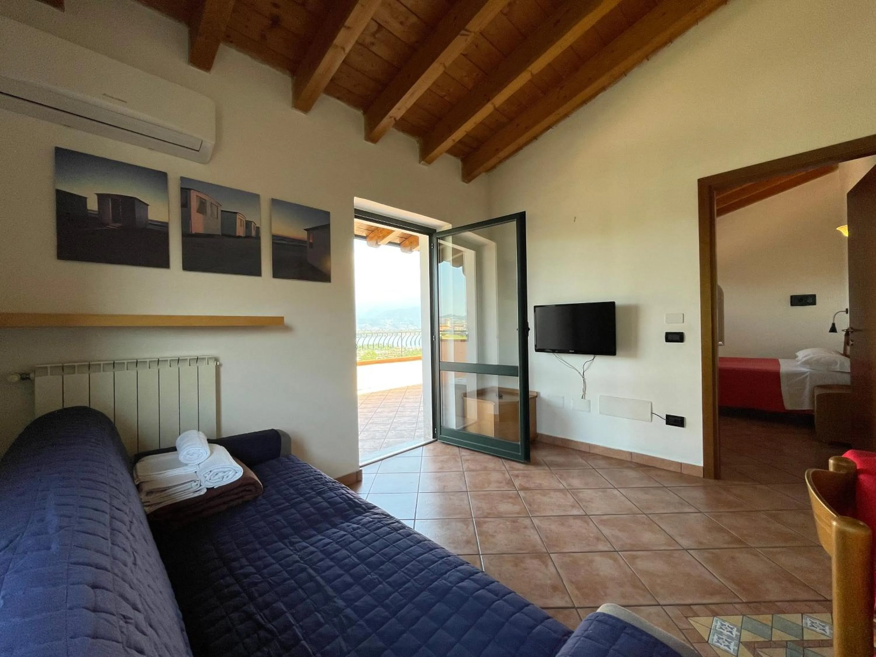 Living room, Bed in Residence Bellavista