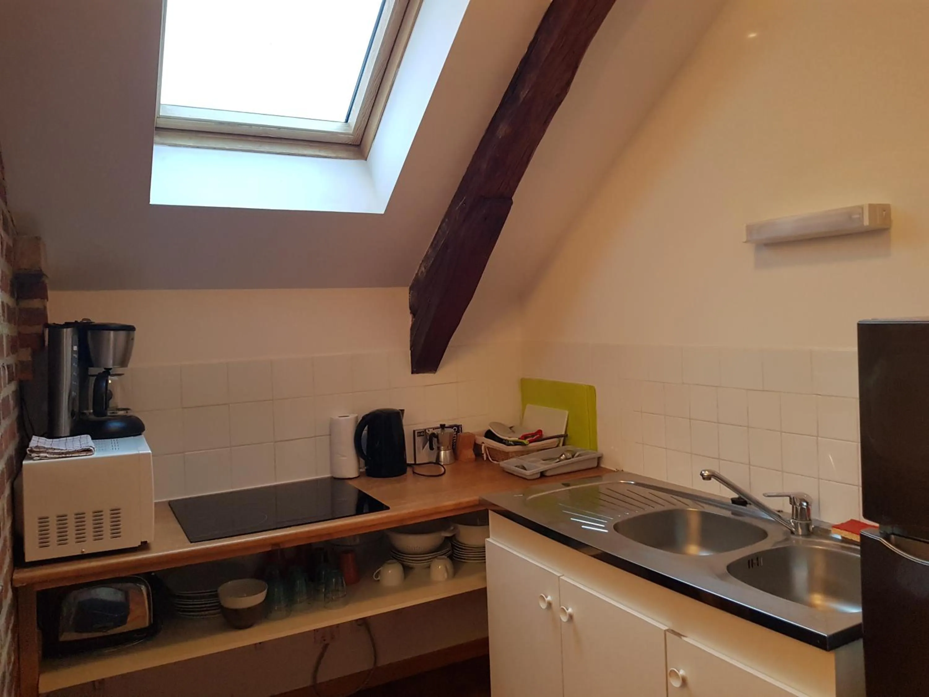 Kitchen or kitchenette in Appart'Hôtel de la Tour