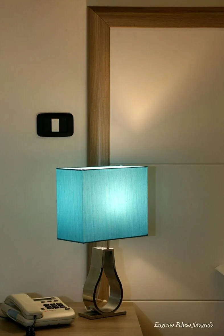 Bed in Caravaggio Hotel