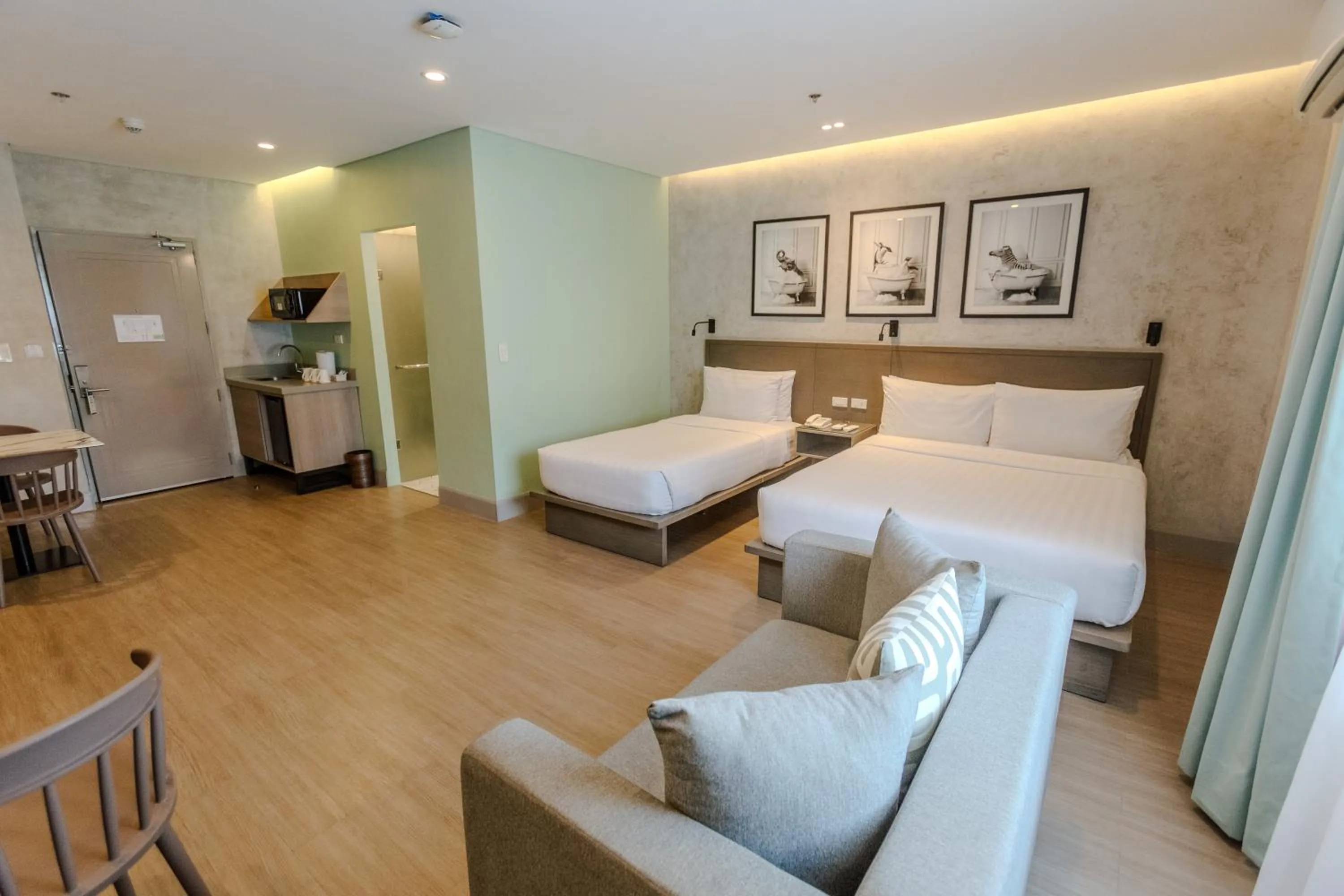 Seating area, Bed in Primeway Suites Cebu