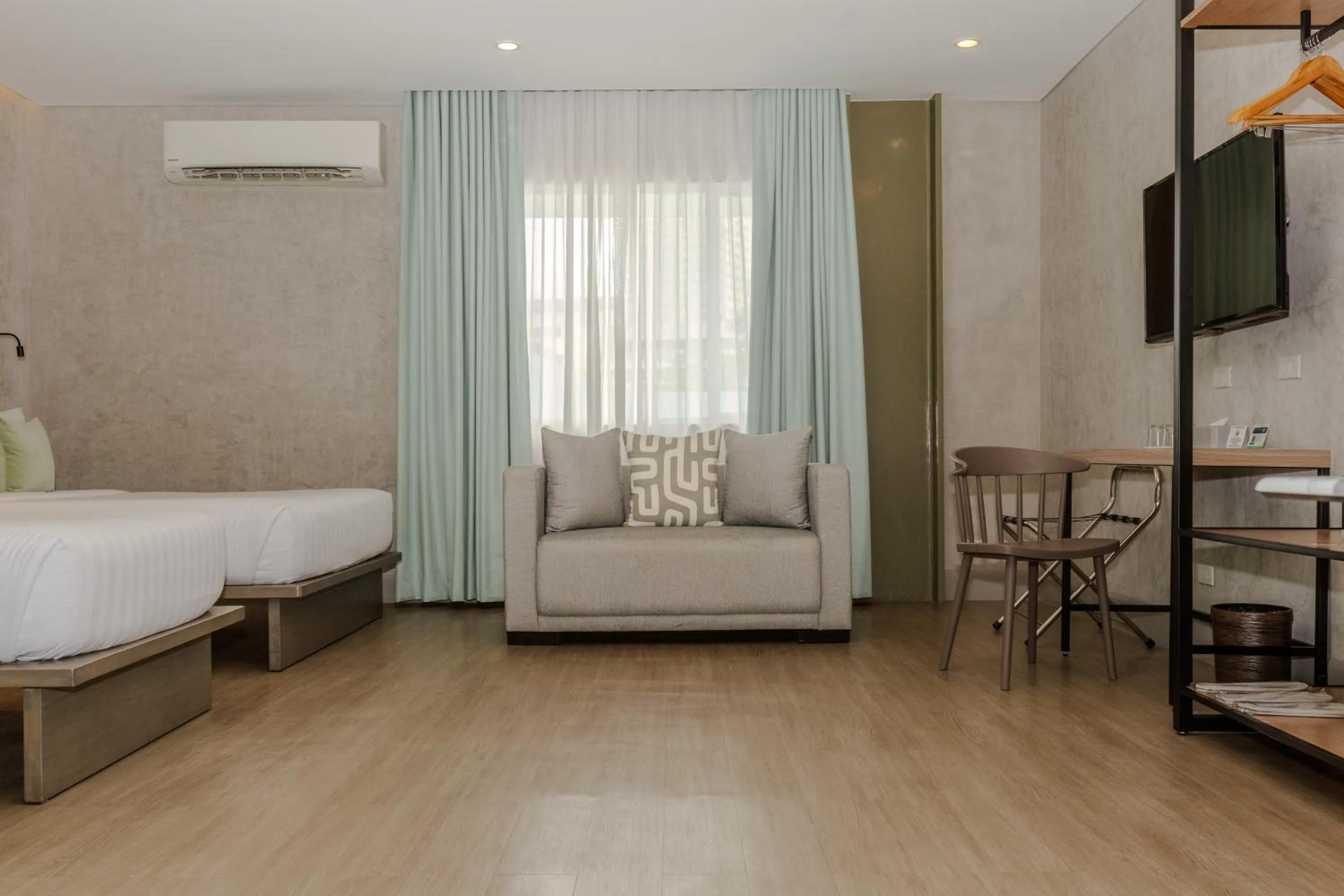 Seating area, Bed in Primeway Suites Cebu