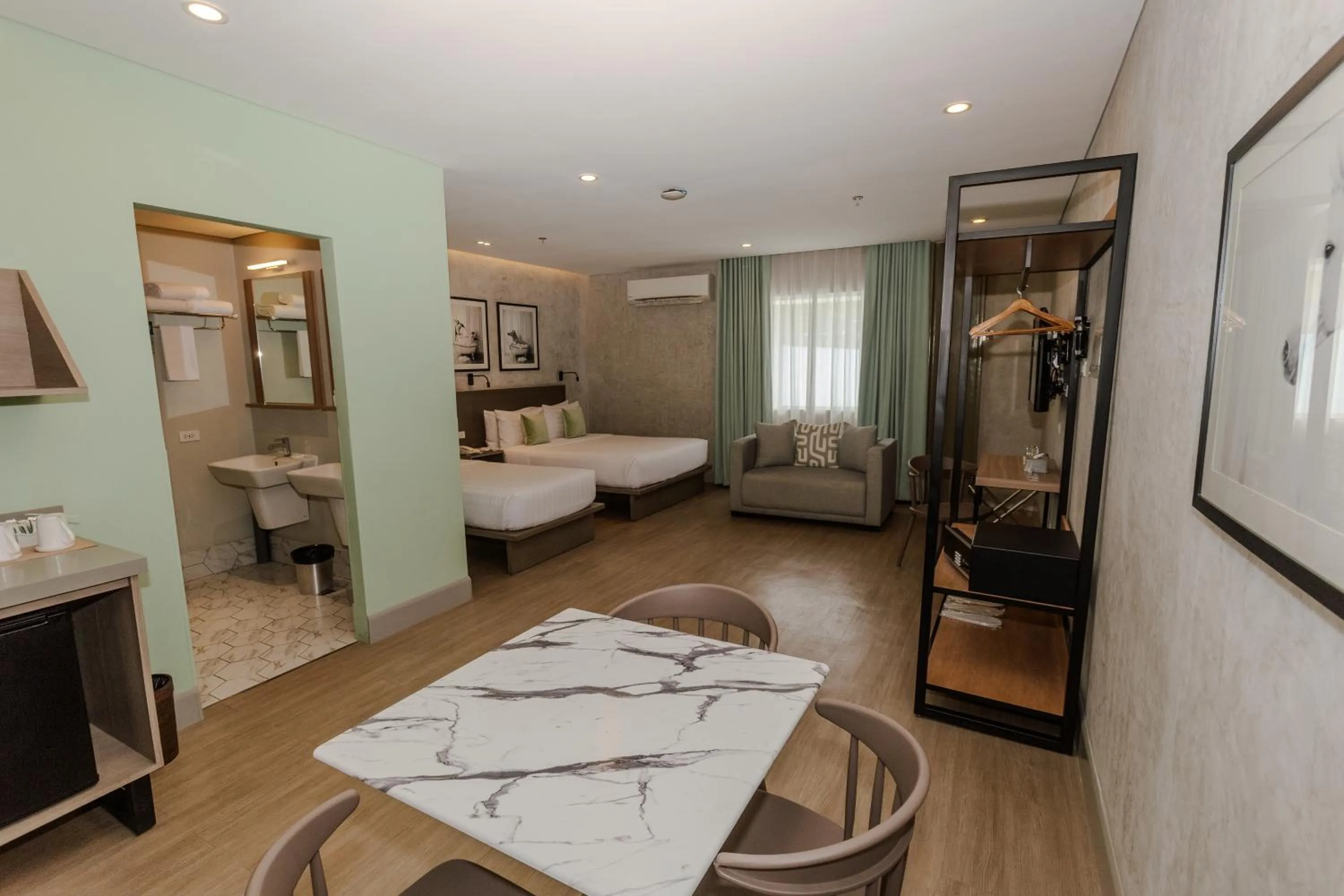 Photo of the whole room, Bed in Primeway Suites Cebu