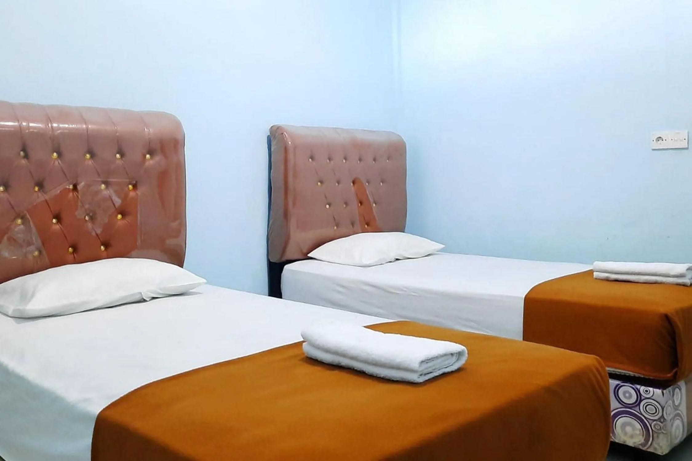 Bed in Prima Homestay Mentawai Mitra RedDoorz