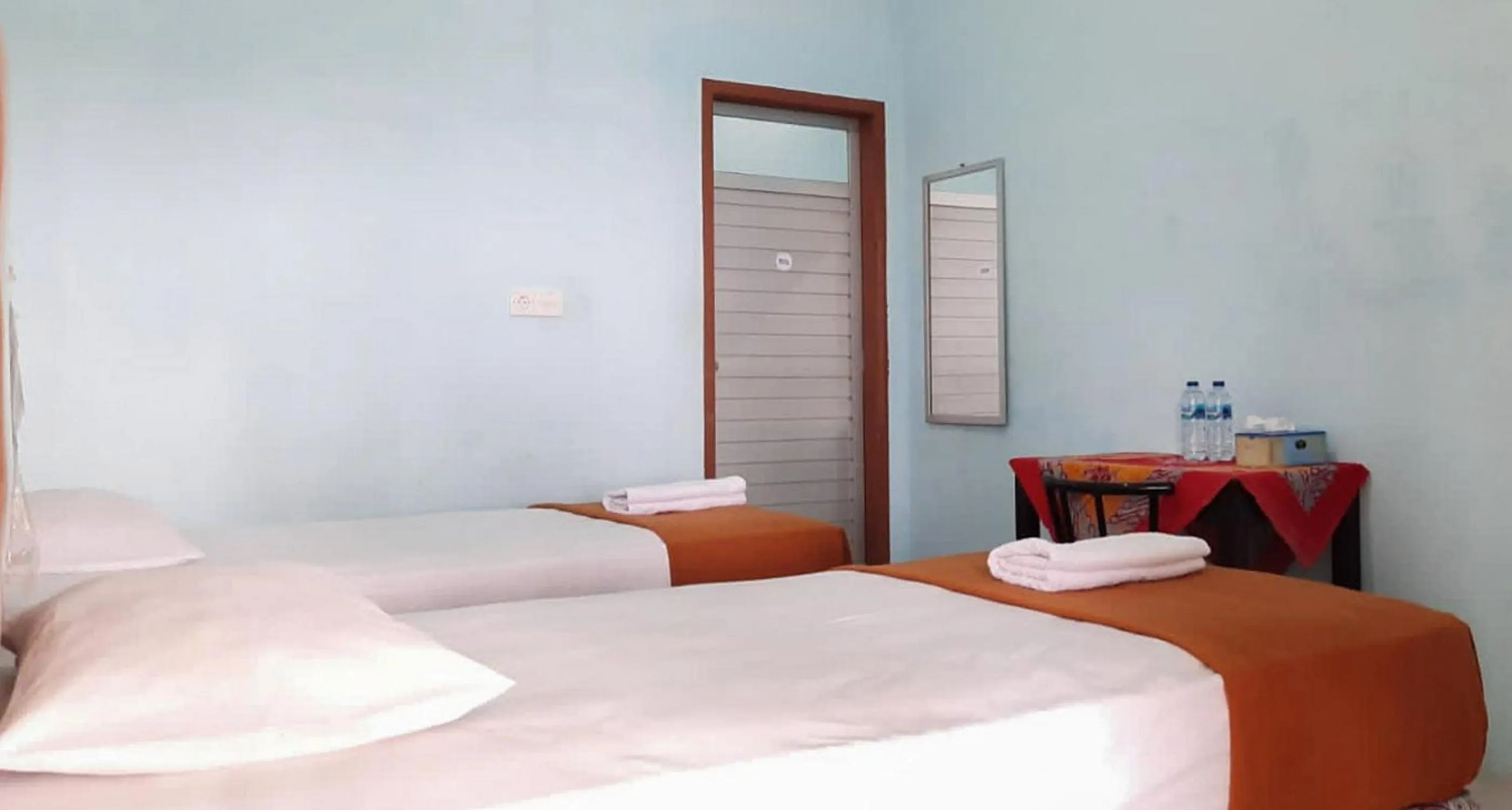 Bed in Prima Homestay Mentawai Mitra RedDoorz