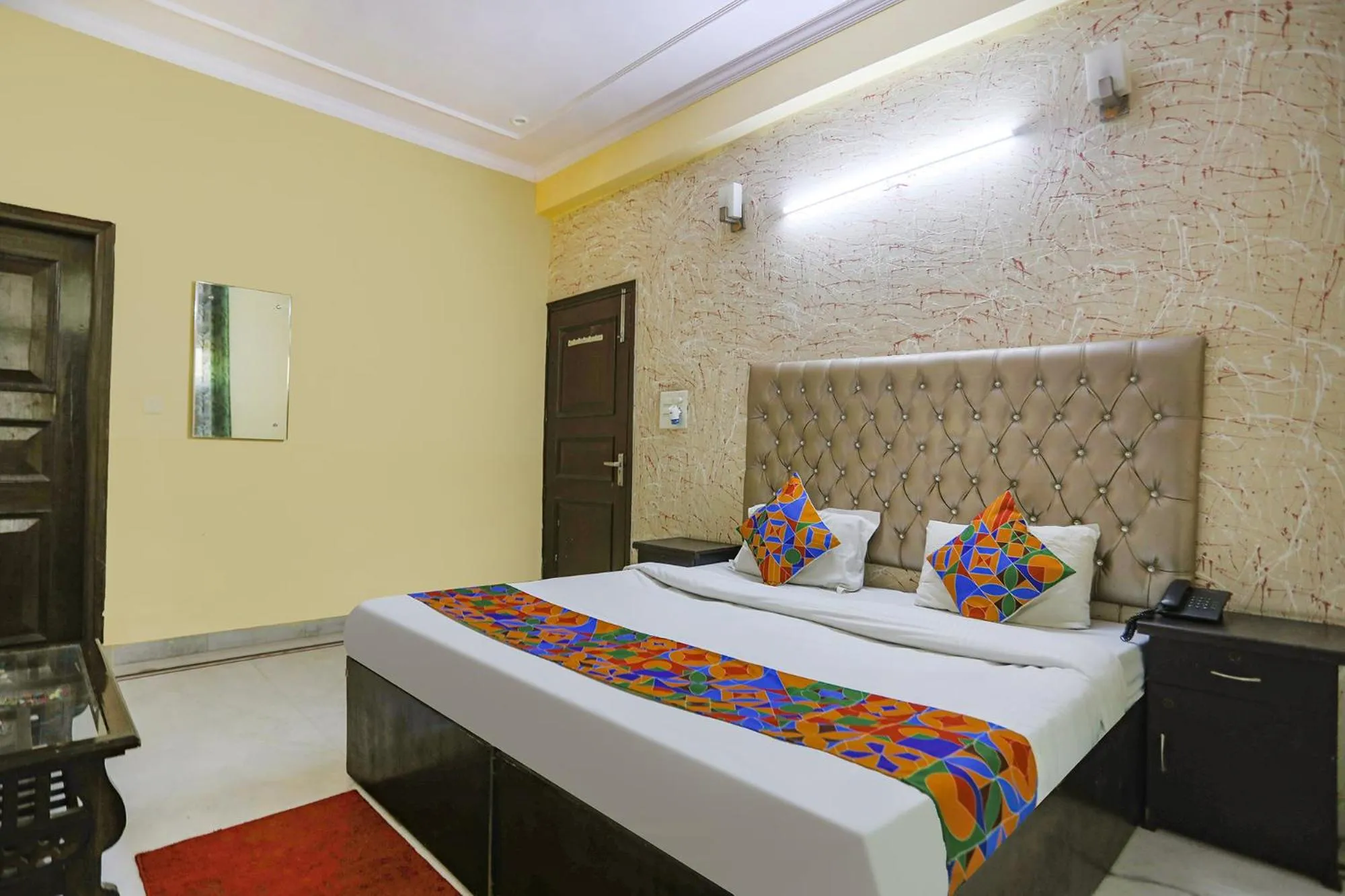 Bed in FabHotel HM Palace