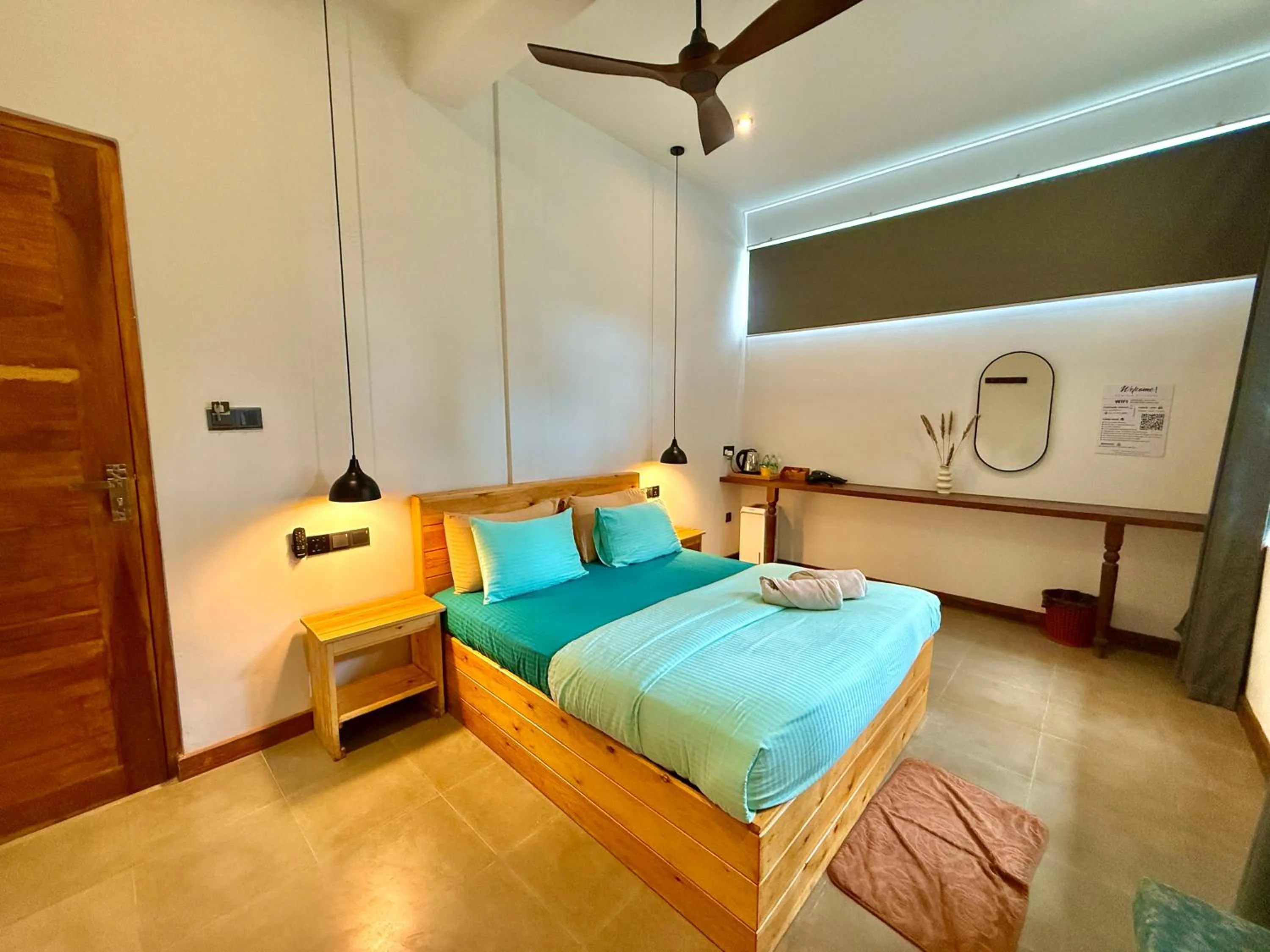 Bed in Ella Inn Hotel