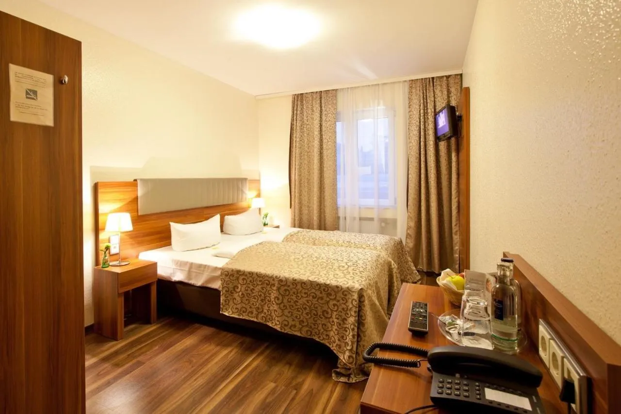 Photo of the whole room, Bed in Hotel Frankfurt Messe