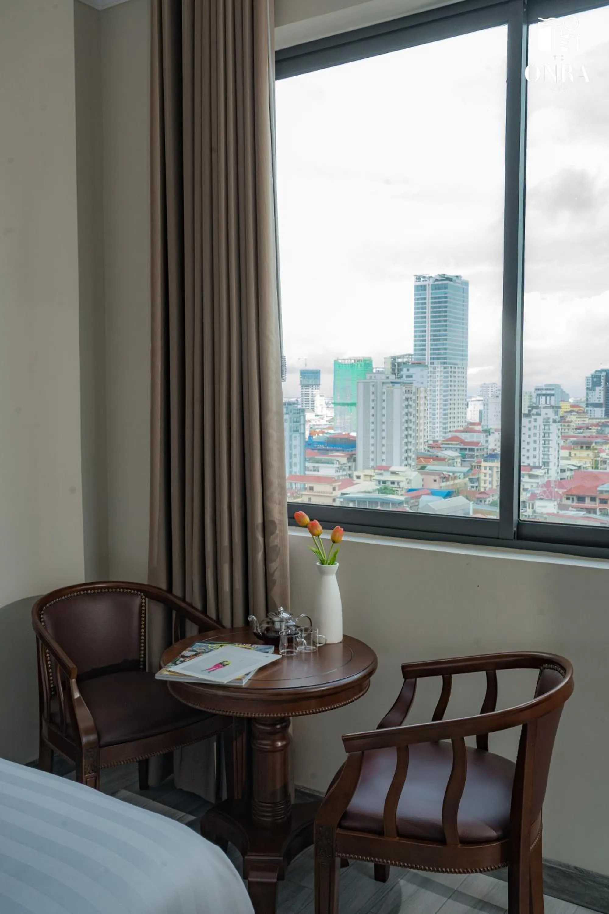 Seating area, Bed in The ONRA Hotel