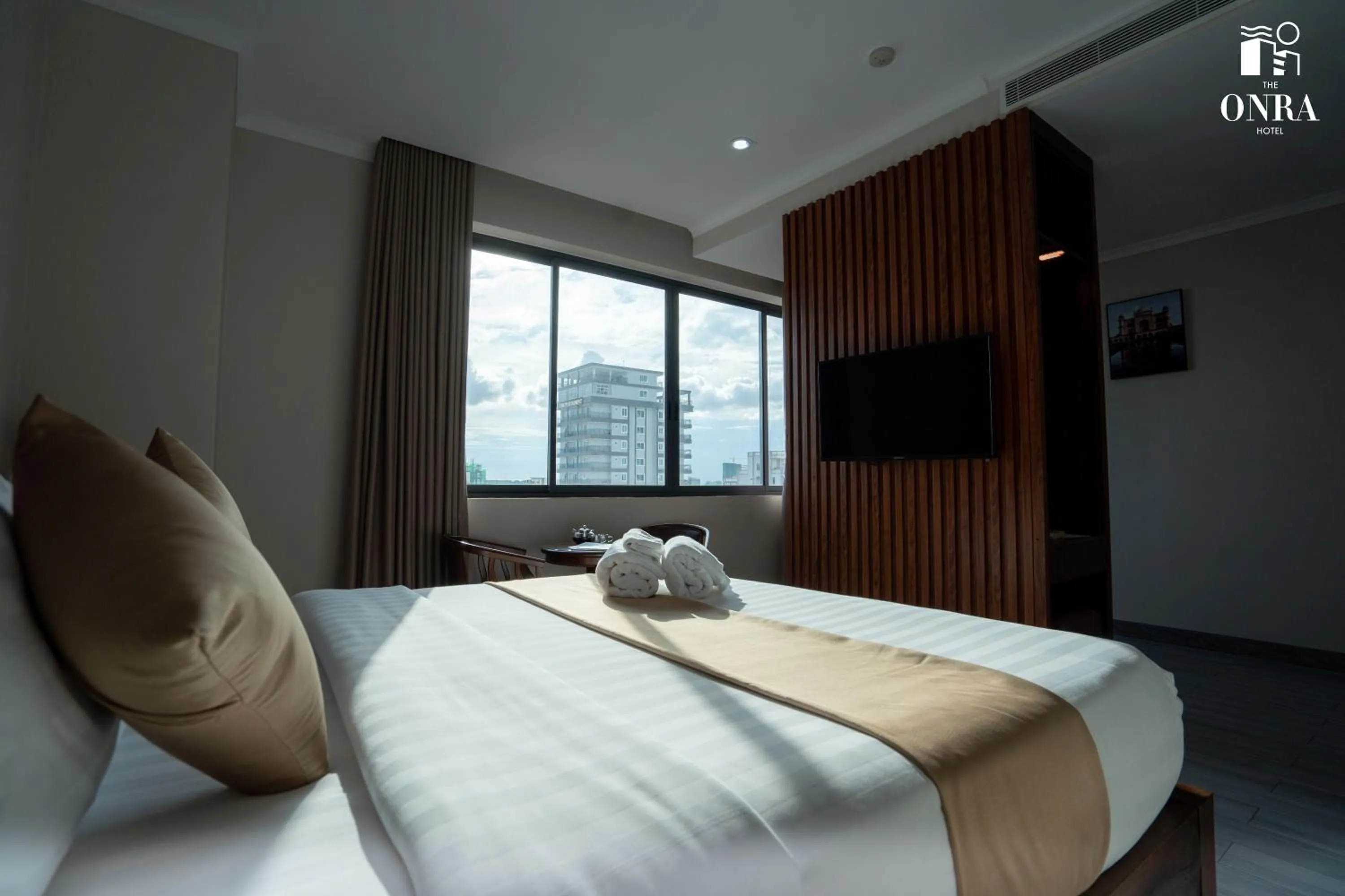 Communal lounge/ TV room, Bed in The ONRA Hotel