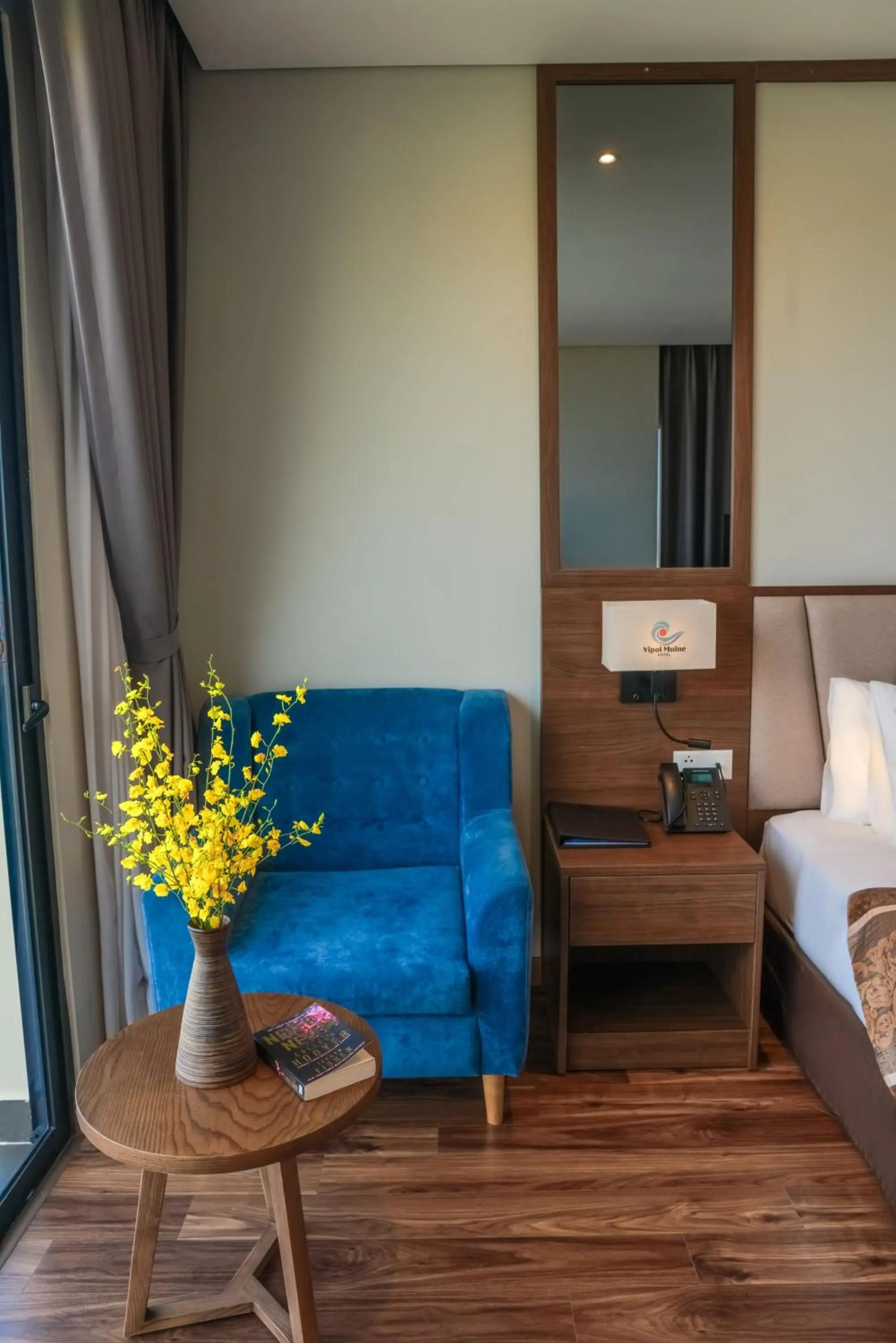 Seating area, Bed in Vipol Mui Ne Hotel & Spa