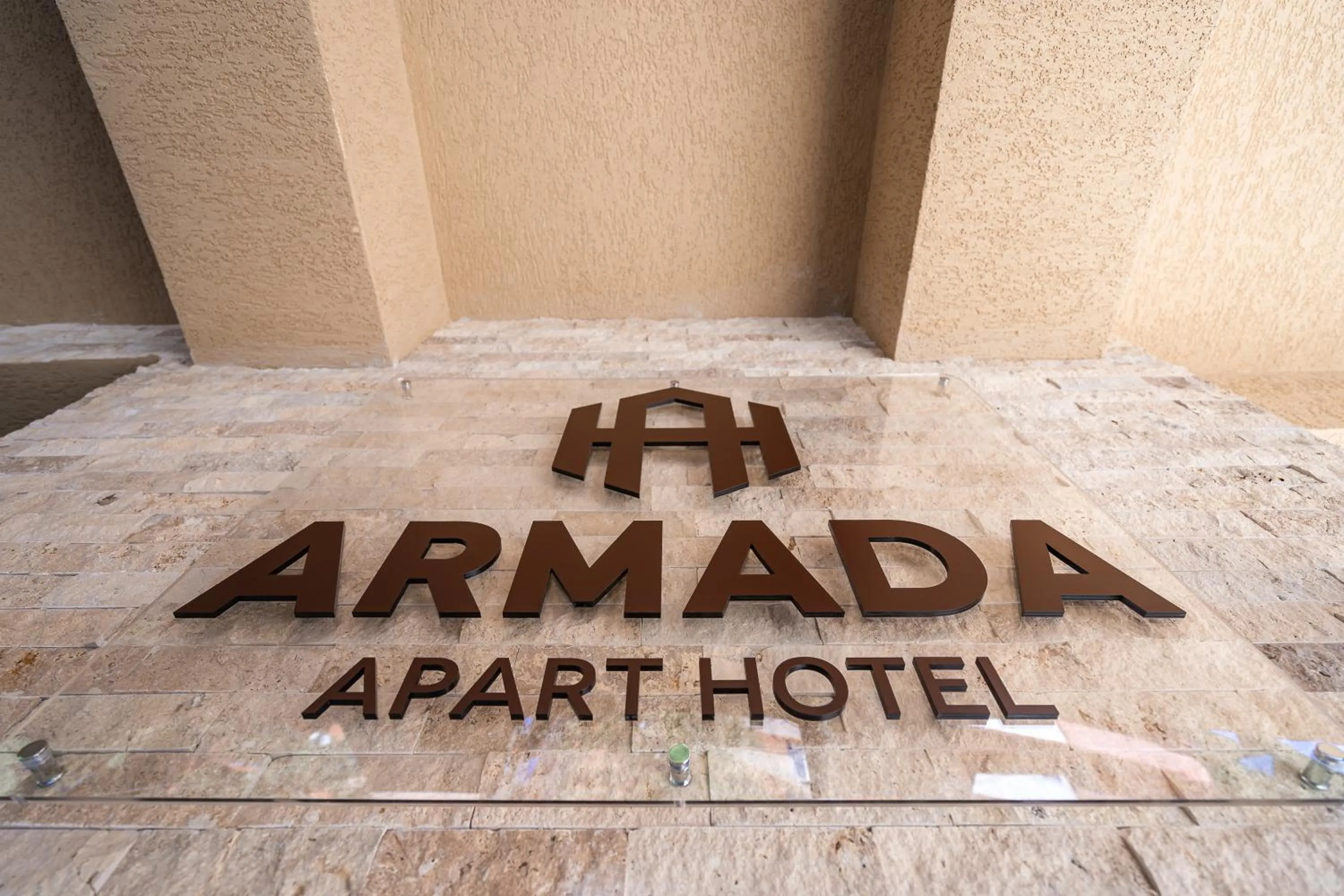 Property logo or sign in Armada Aparthotel