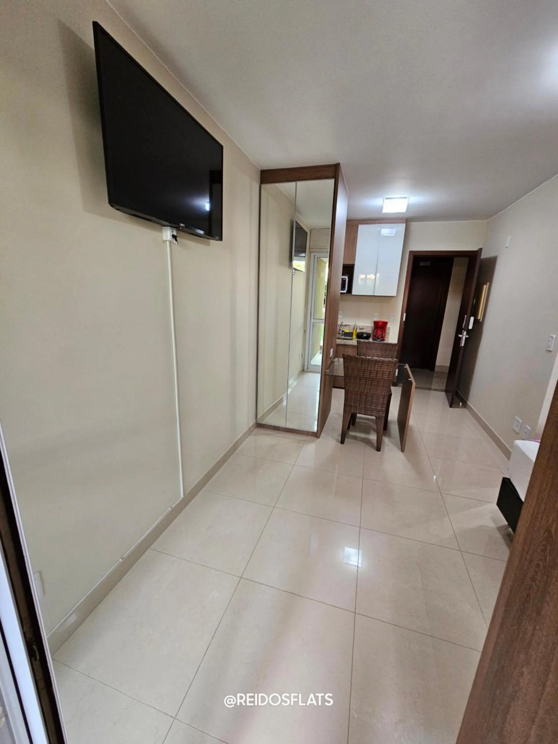 TV and multimedia in The Sun Resort By Rei dos Flats