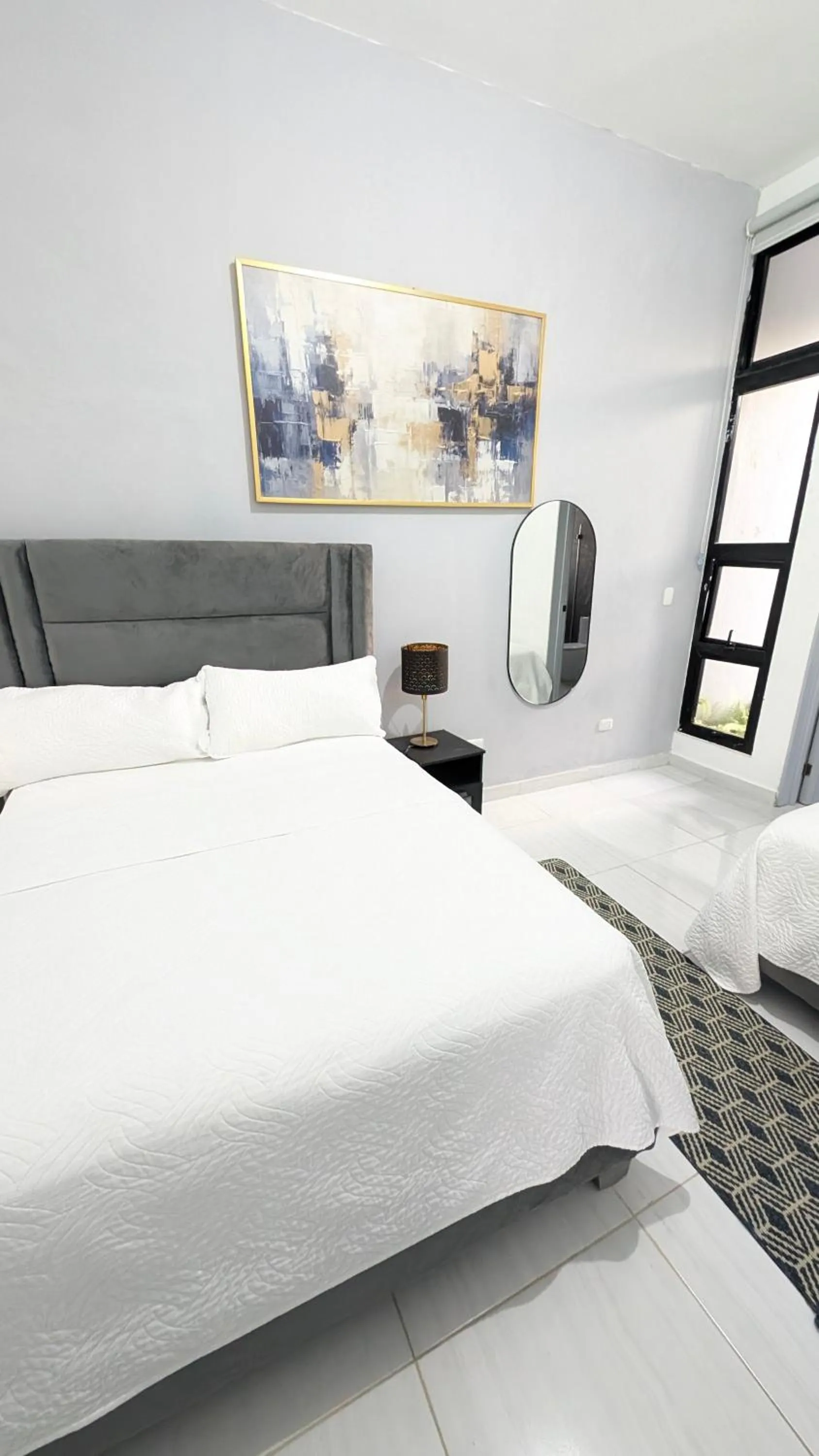 Bed in Skylight Suites Hotel