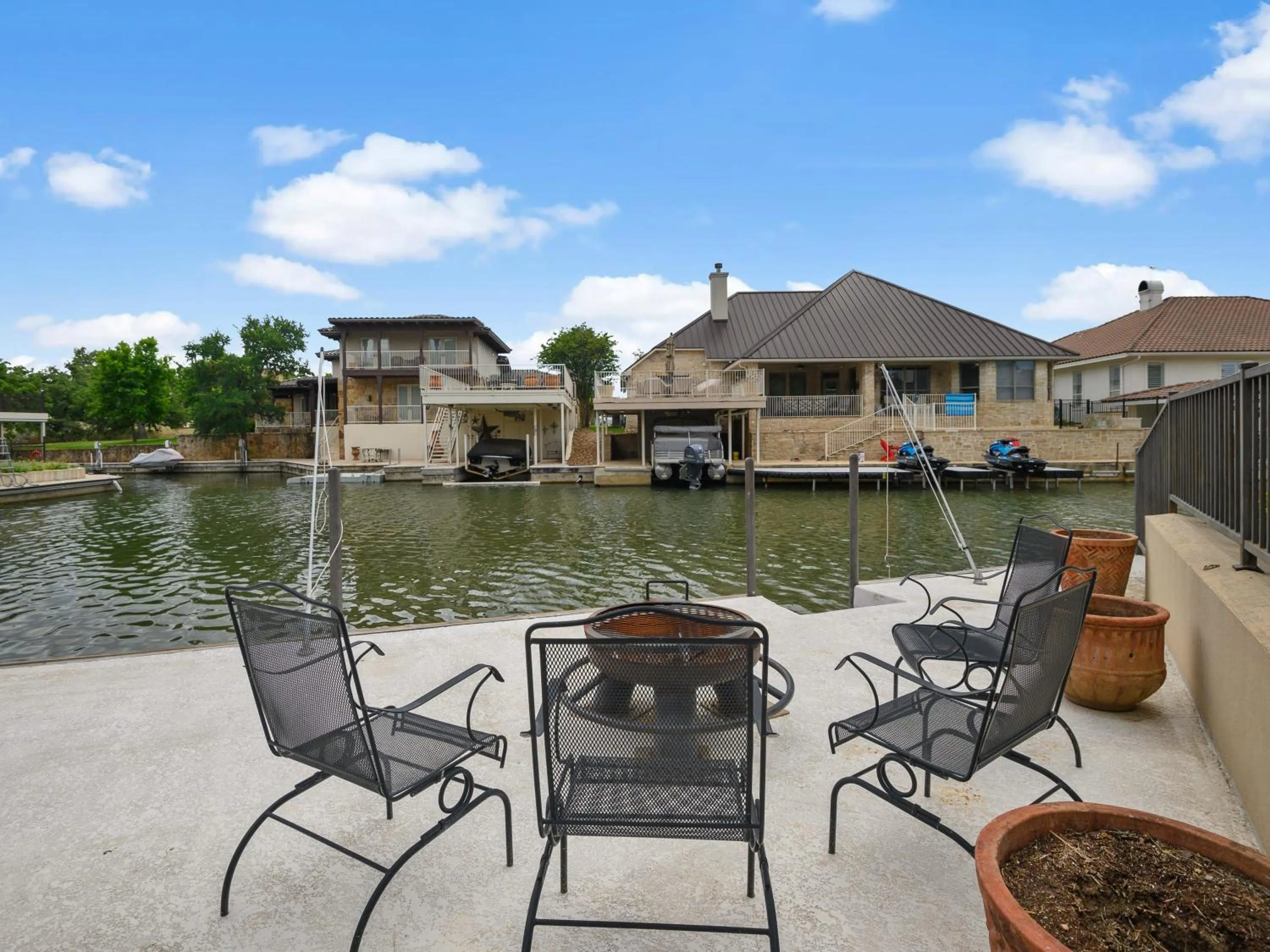 Waterfront Home with Boat Slip, Spacious Outdoor Patio and a Fenced Yard