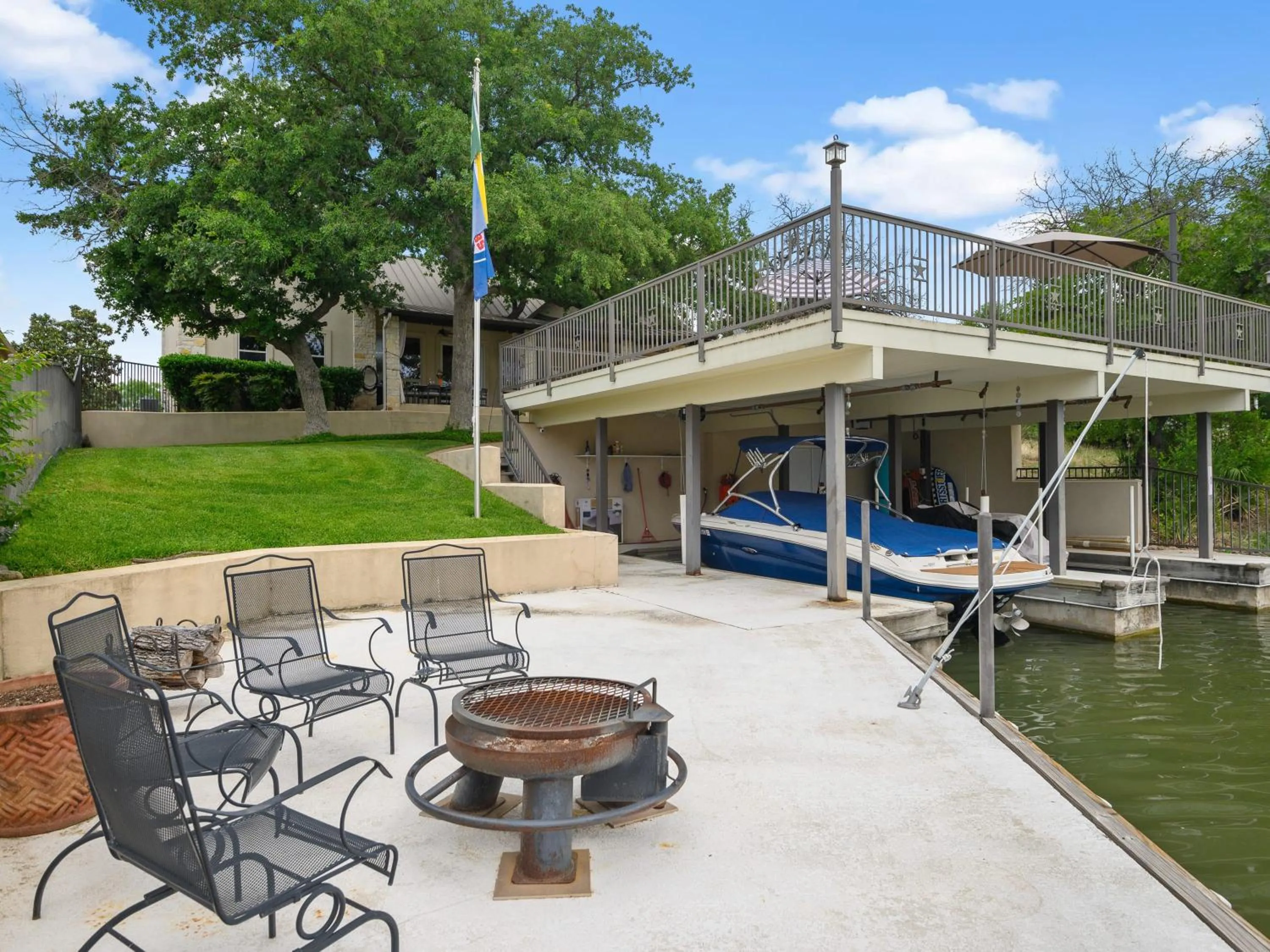 Waterfront Home with Boat Slip, Spacious Outdoor Patio and a Fenced Yard