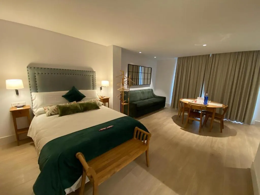 Living room, Bed in Apartamentos Turísticos La Plaza