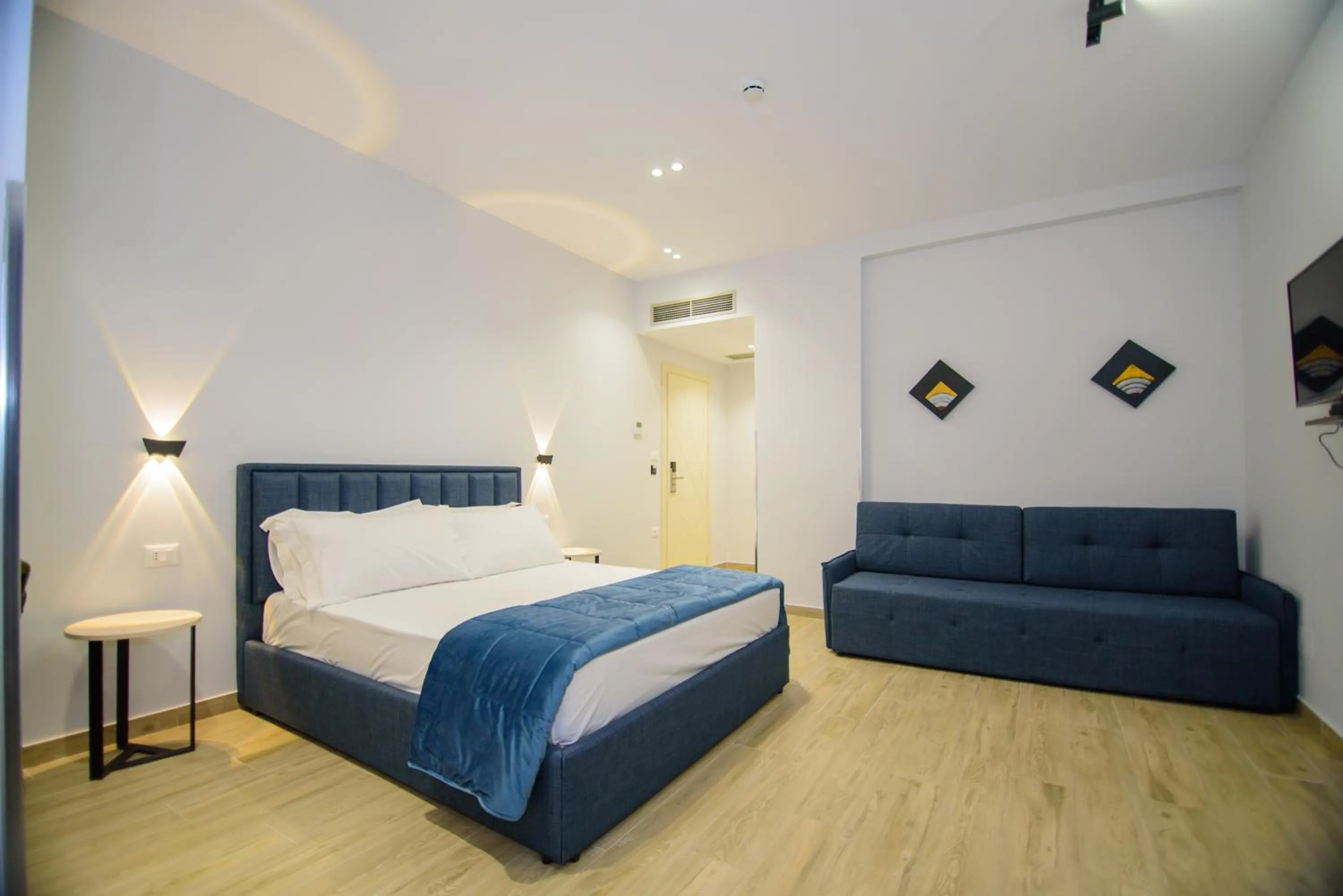 Bed in Palm Side Hotel