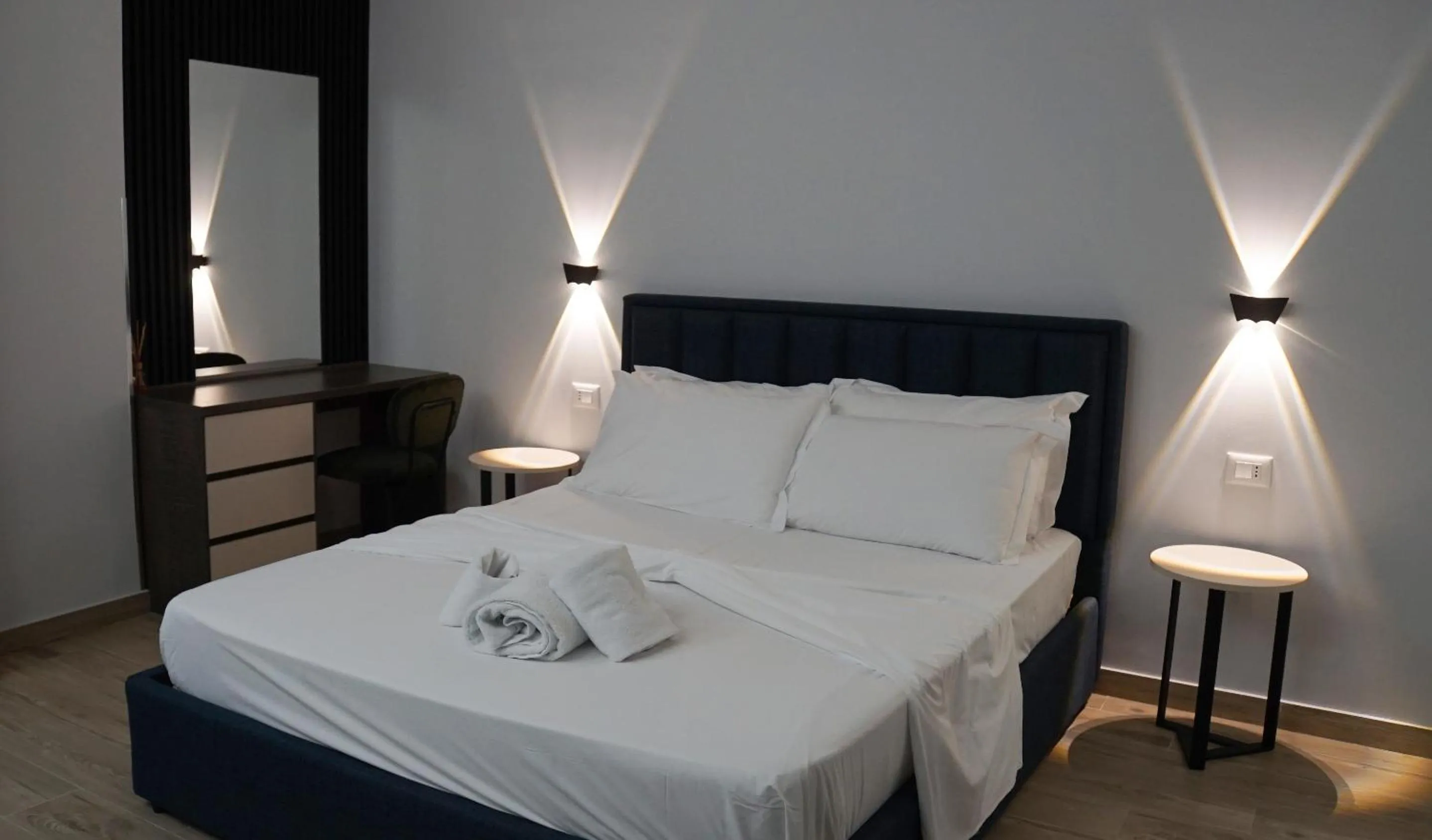 Bed in Palm Side Hotel