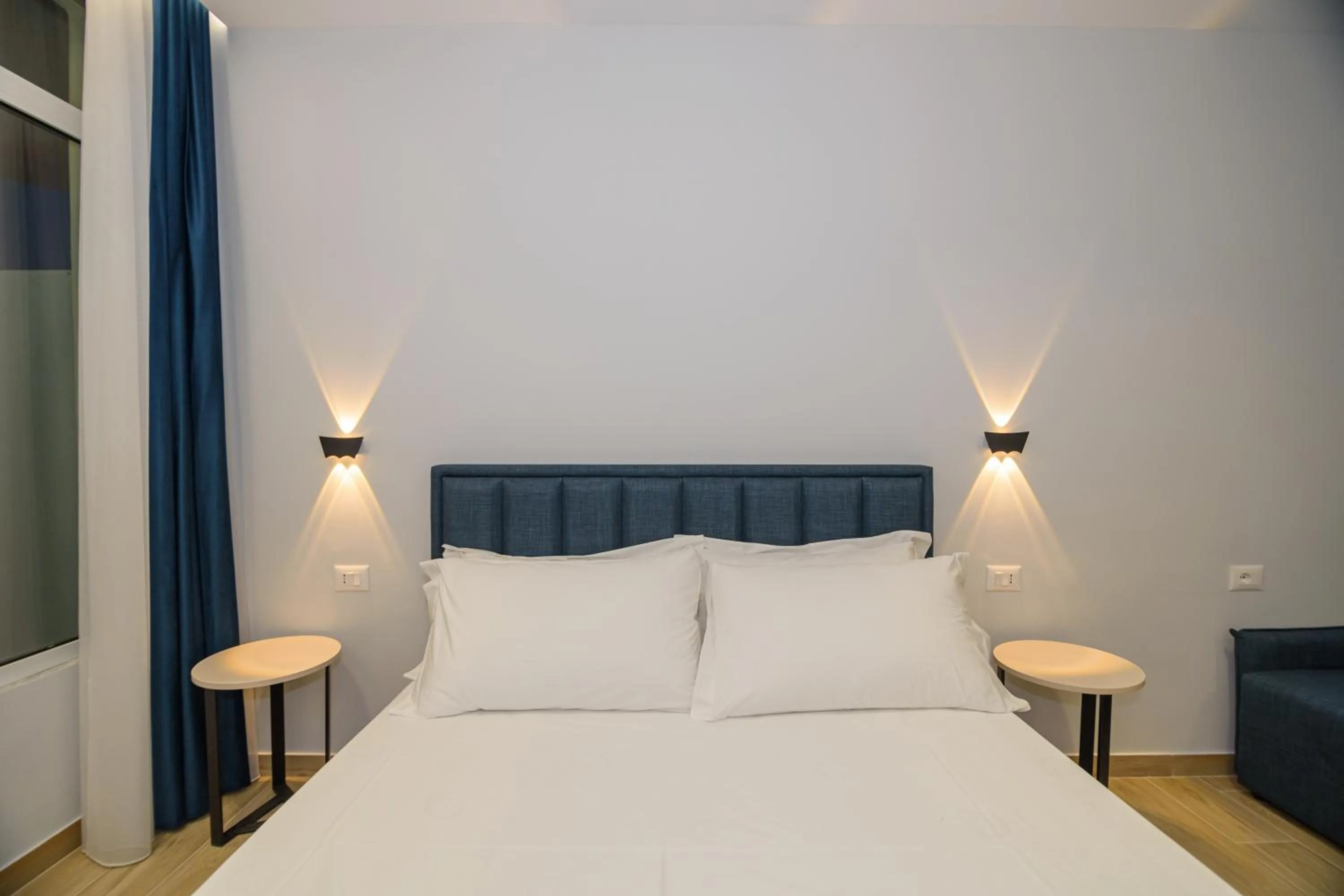 Bed in Palm Side Hotel