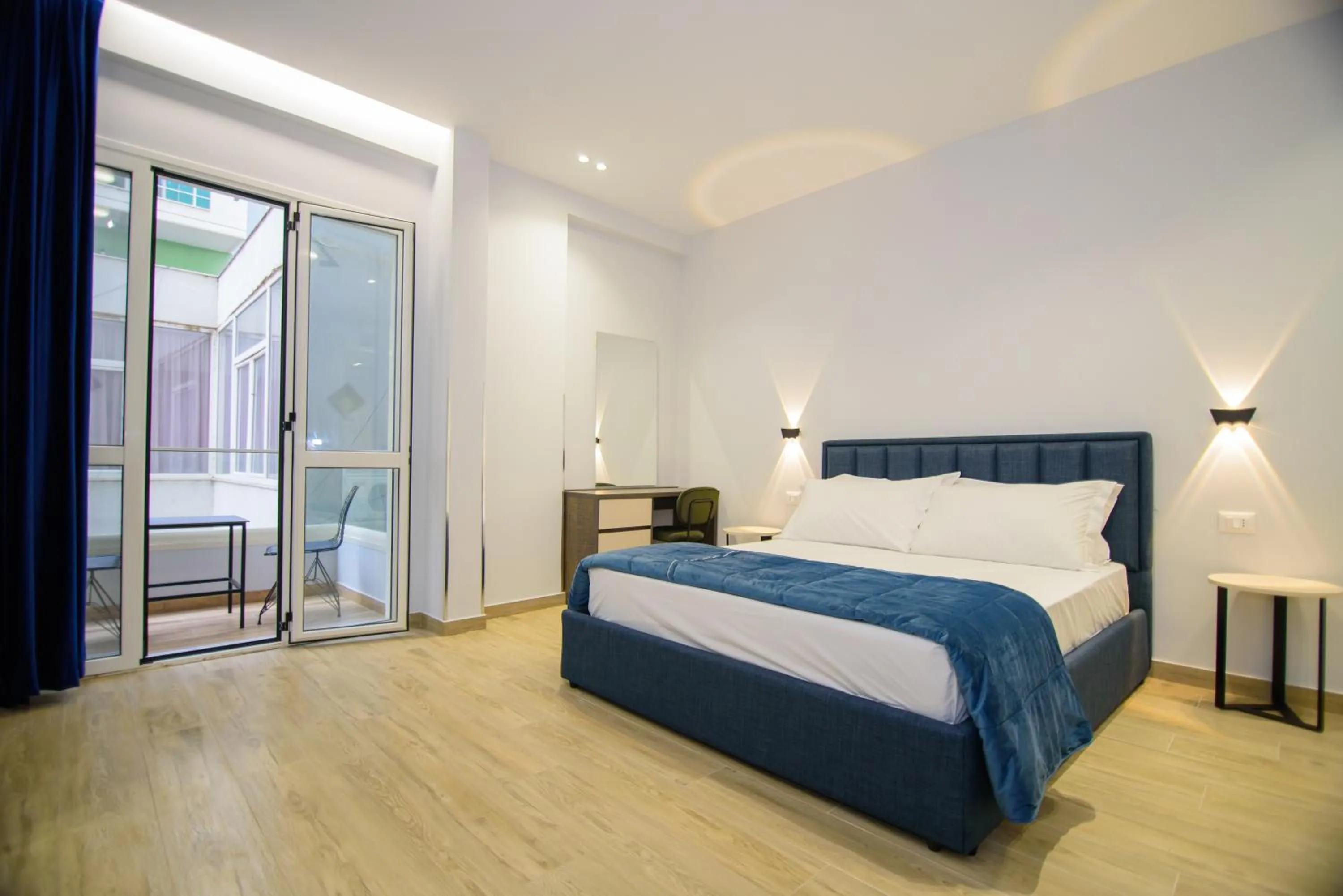 Bed in Palm Side Hotel