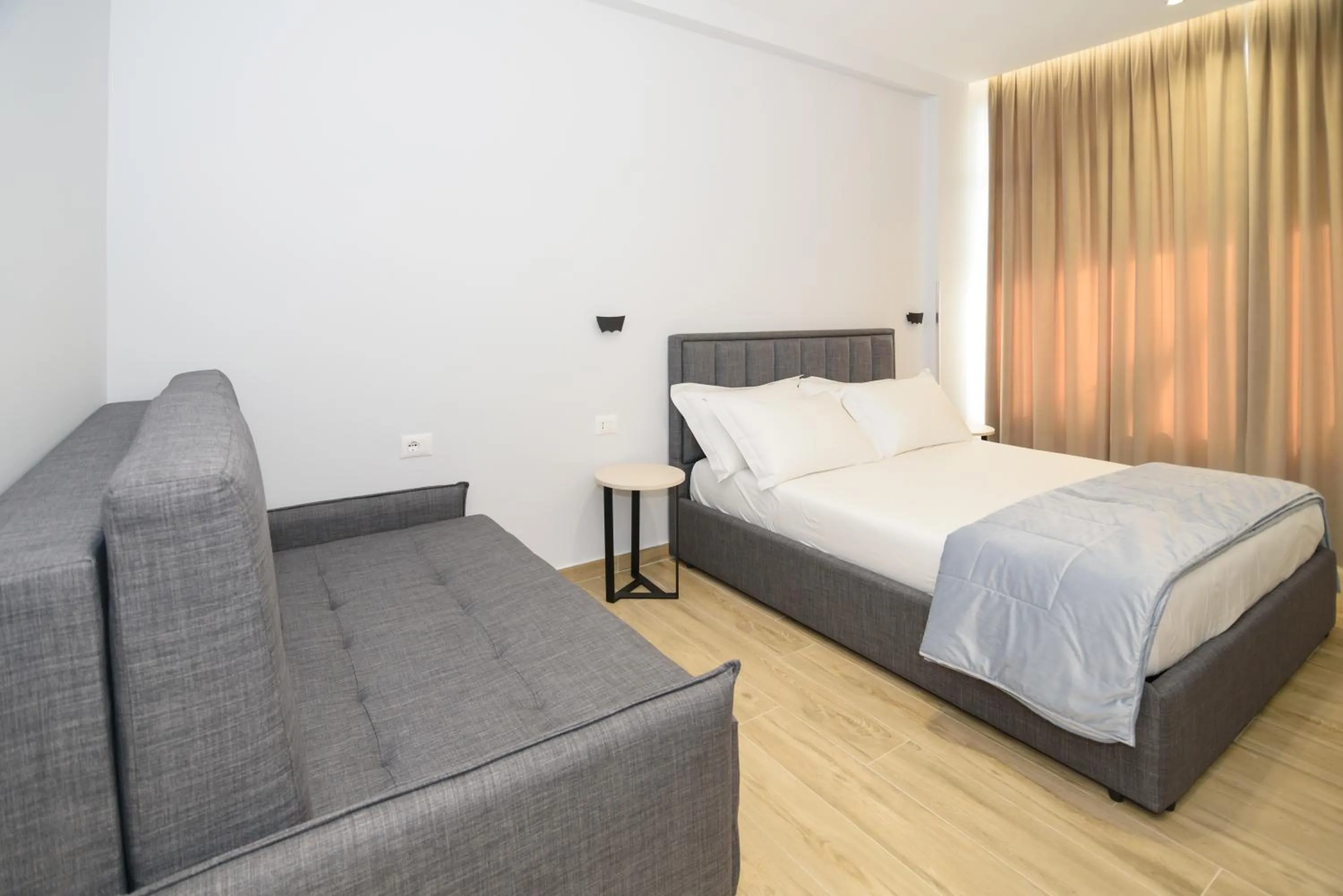 Bed in Palm Side Hotel