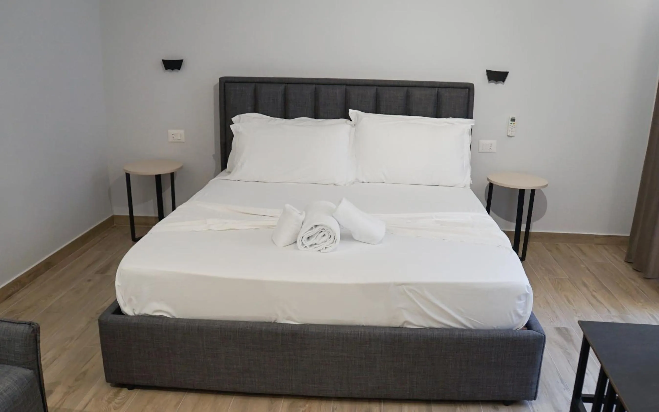 Bed in Palm Side Hotel