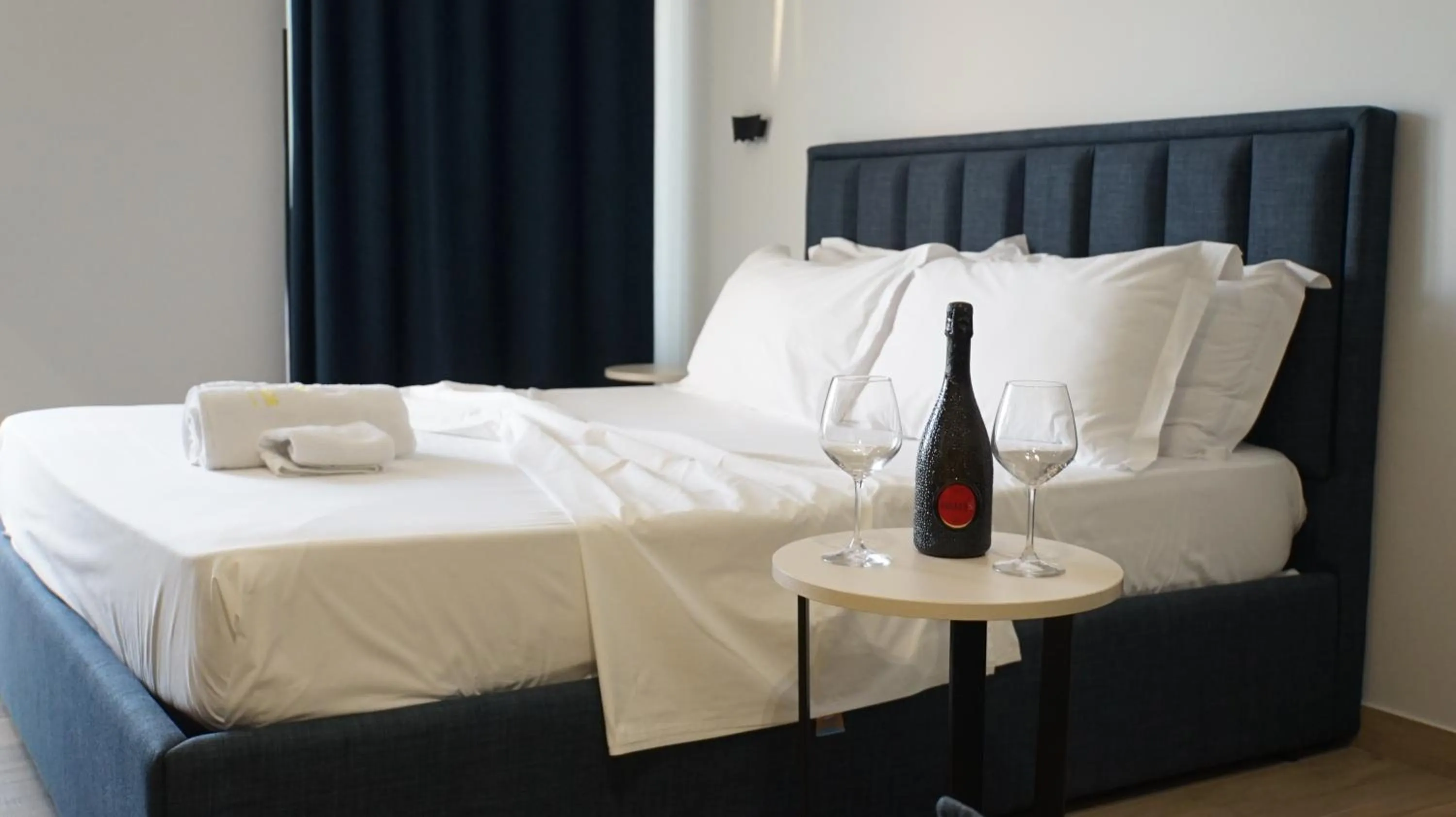 Bed in Palm Side Hotel