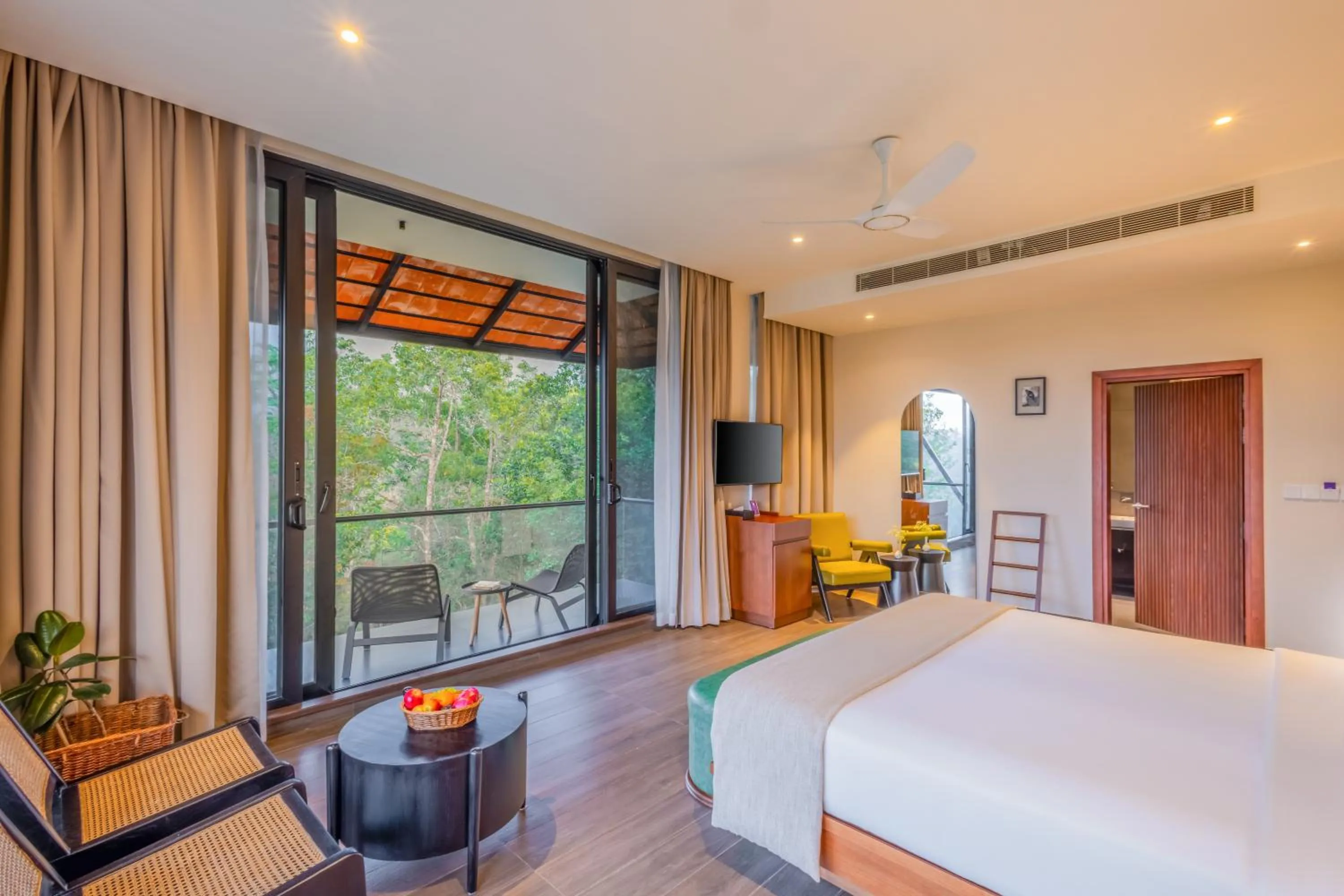 Communal lounge/ TV room, Bed in Flora Vythiri Resort Wayanad