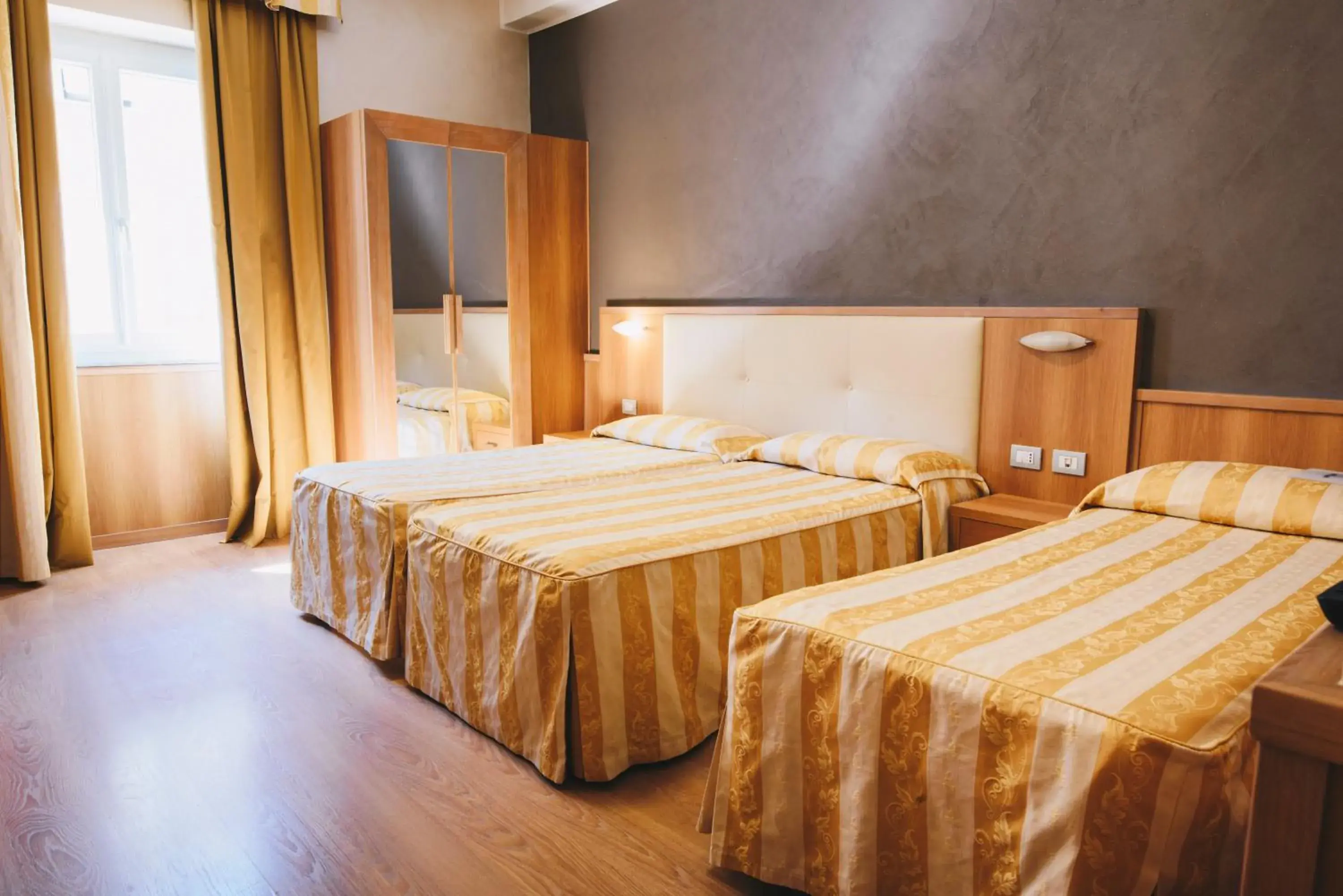 Triple Room in Hotel Corallo Triple Room in Hotel Corallo