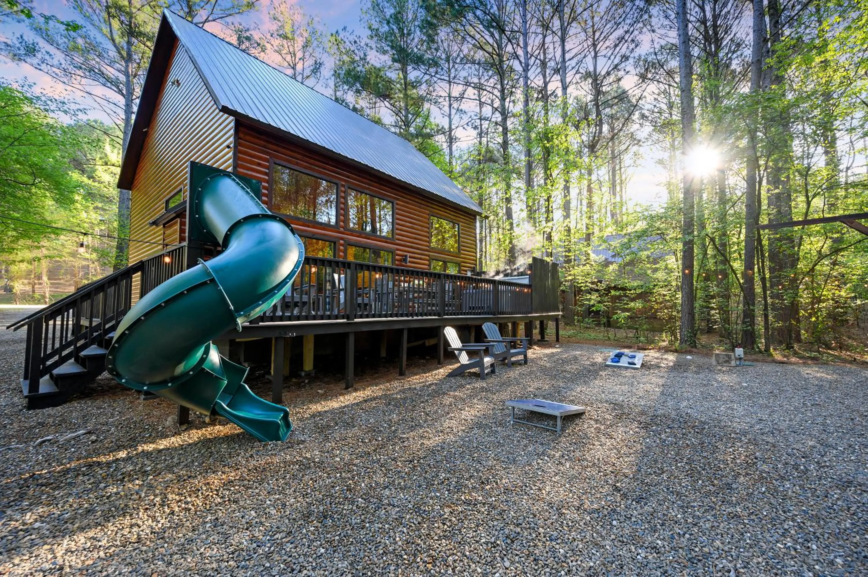 Property building in Hickory Bear - Cabin surrounded by pines, Sleeps 10, Hot Tub, Fire Pit, Arcade, Foosball Table & Deck Slide