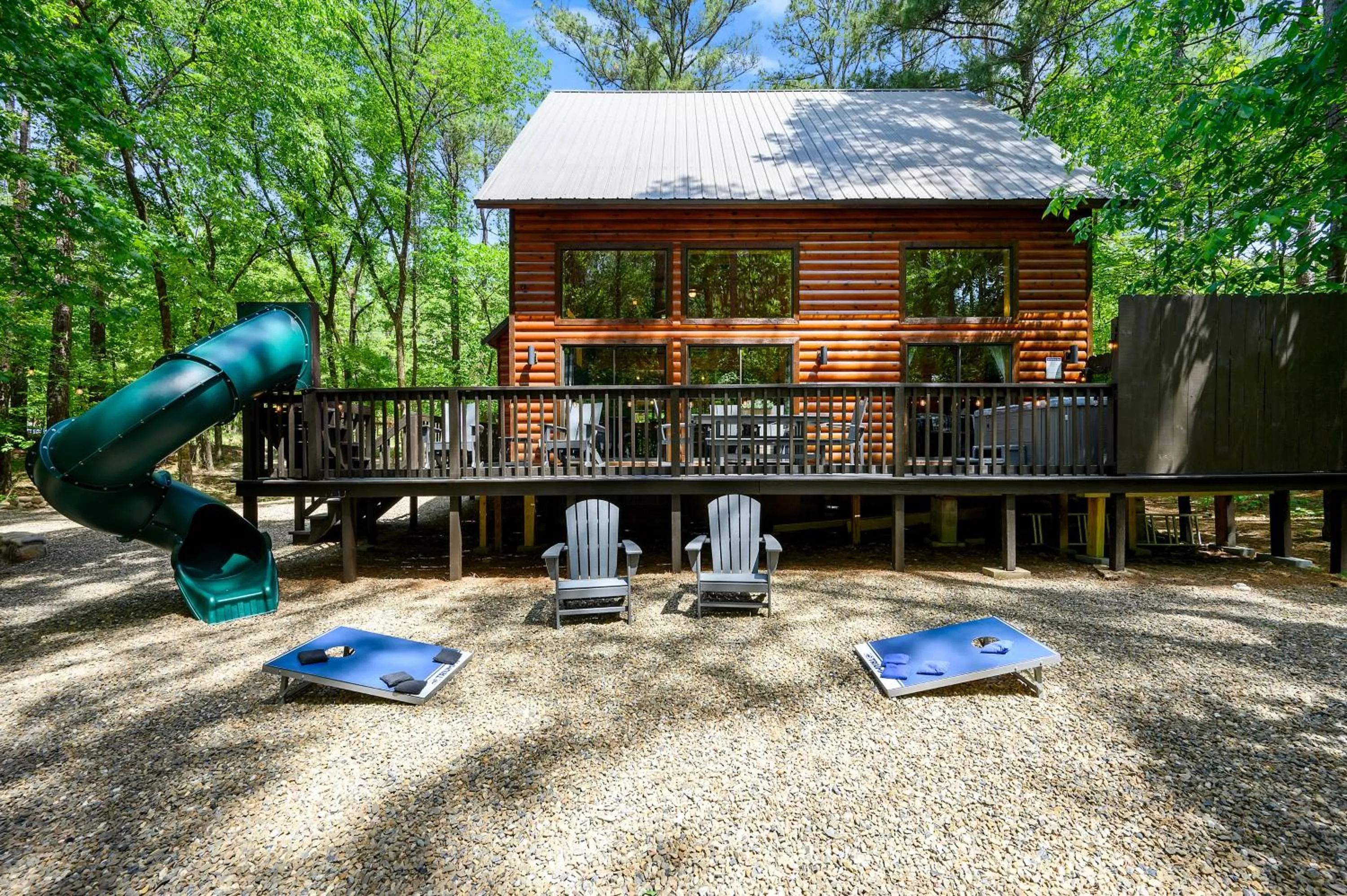 Property building in Hickory Bear - Cabin surrounded by pines, Sleeps 10, Hot Tub, Fire Pit, Arcade, Foosball Table & Deck Slide
