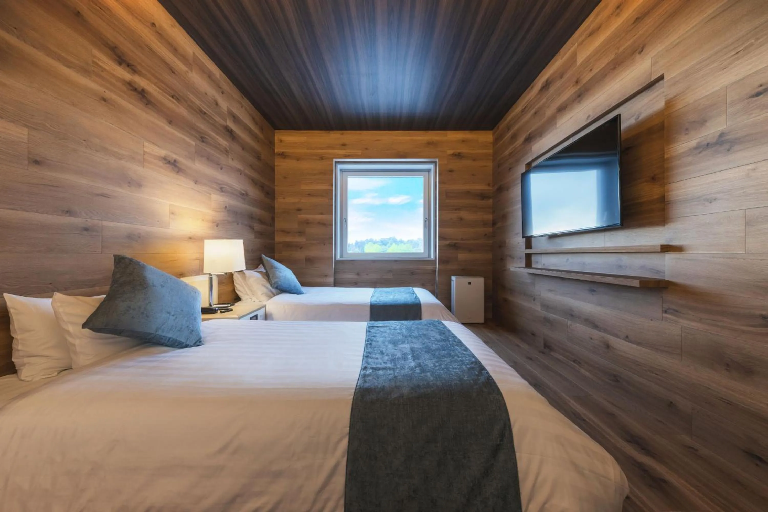 Bed in Takamiya Hotel Rurikura Resort