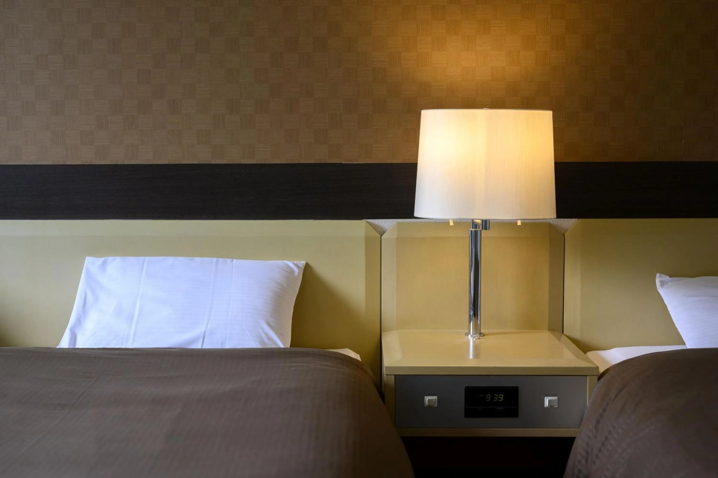 Bed in Takamiya Hotel Rurikura Resort