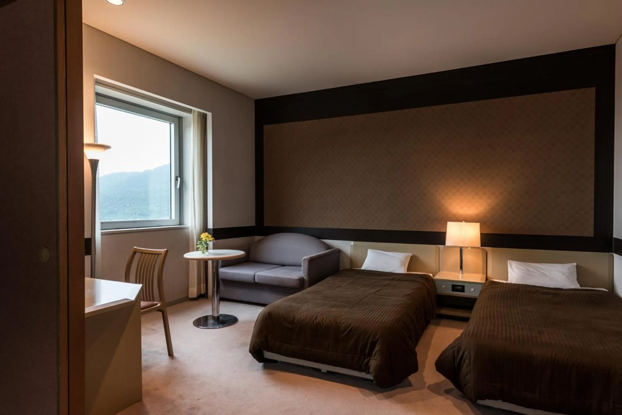 Bed in Takamiya Hotel Rurikura Resort