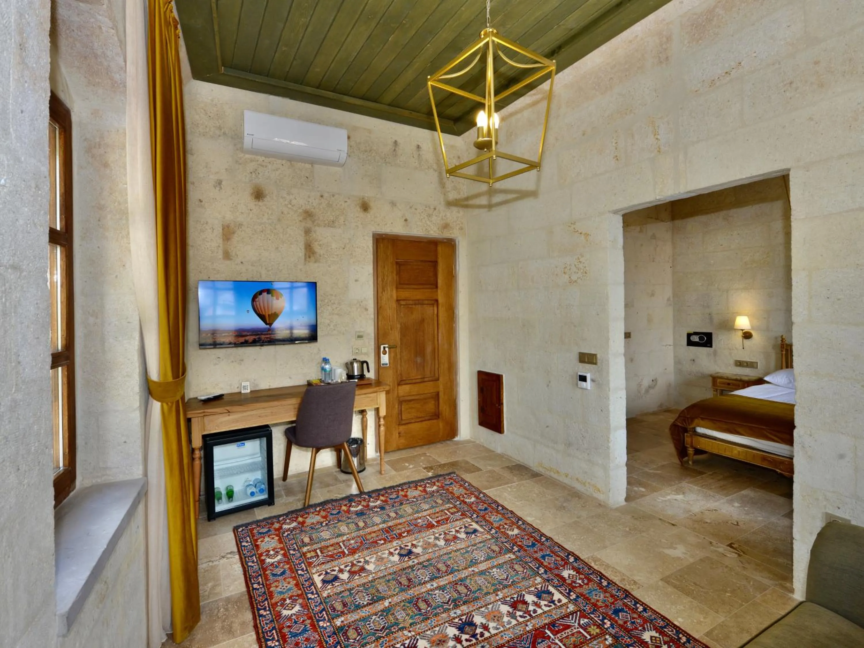 Living room, Bed in Evanthia Cave Suites - Special Class