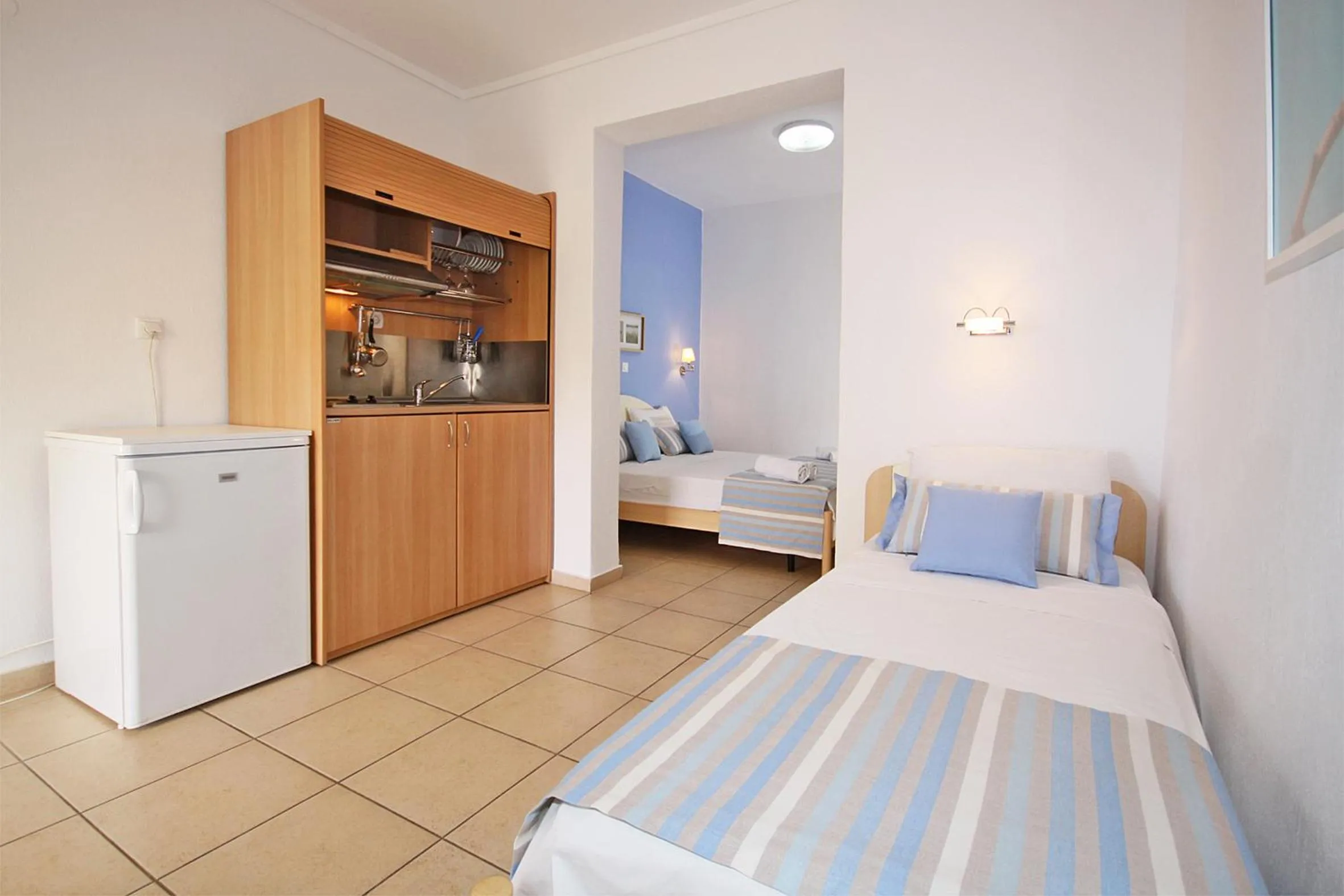 Kitchen or kitchenette, Bed in Miramare Hotel