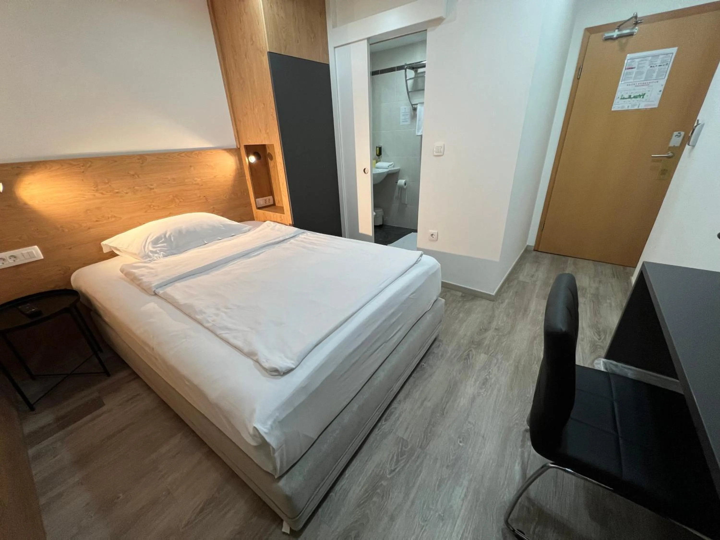 Bed in Garni Hotel Cirman