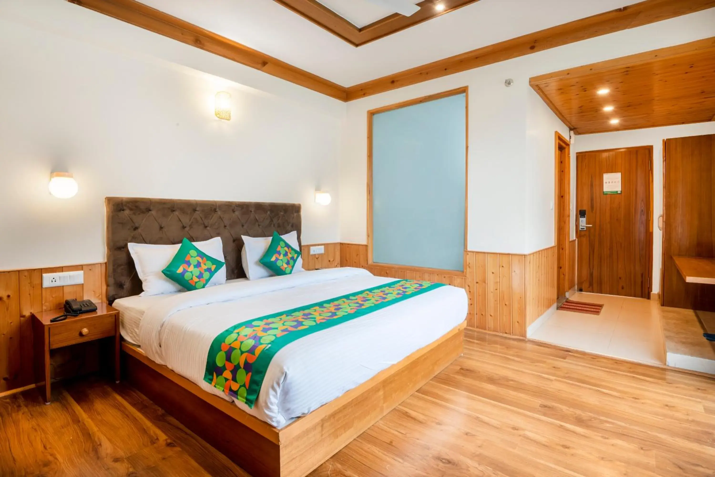 Deluxe Room with Balcony in Treebo Premium Sattva With Mountain View Deluxe Room with Balcony in Treebo Premium Sattva With Mountain View