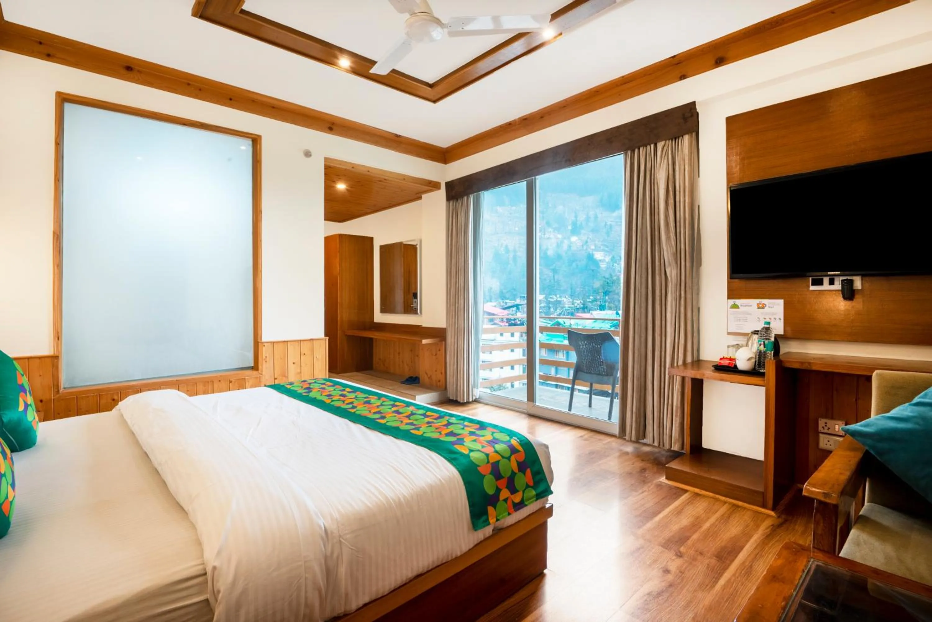 Bedroom, Bed in Treebo Premium Sattva With Mountain View