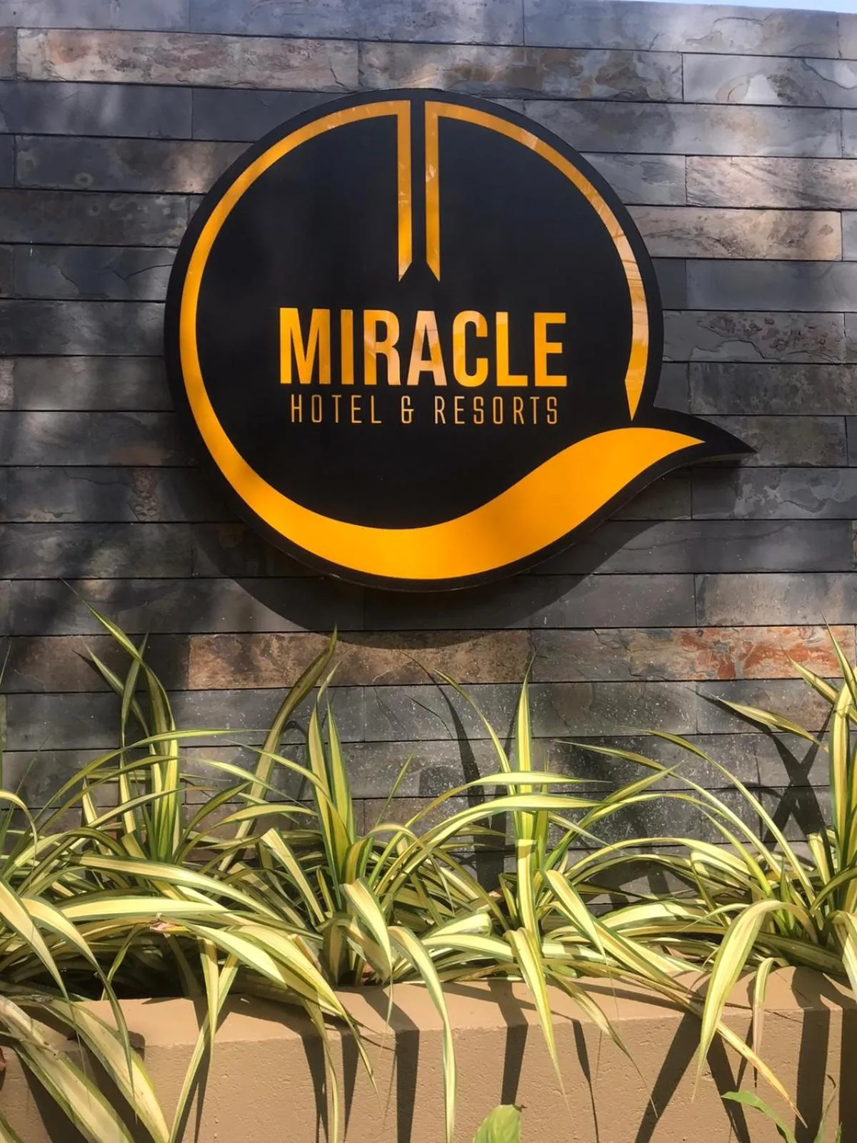 Property logo or sign in Miracle Hotel and Resorts