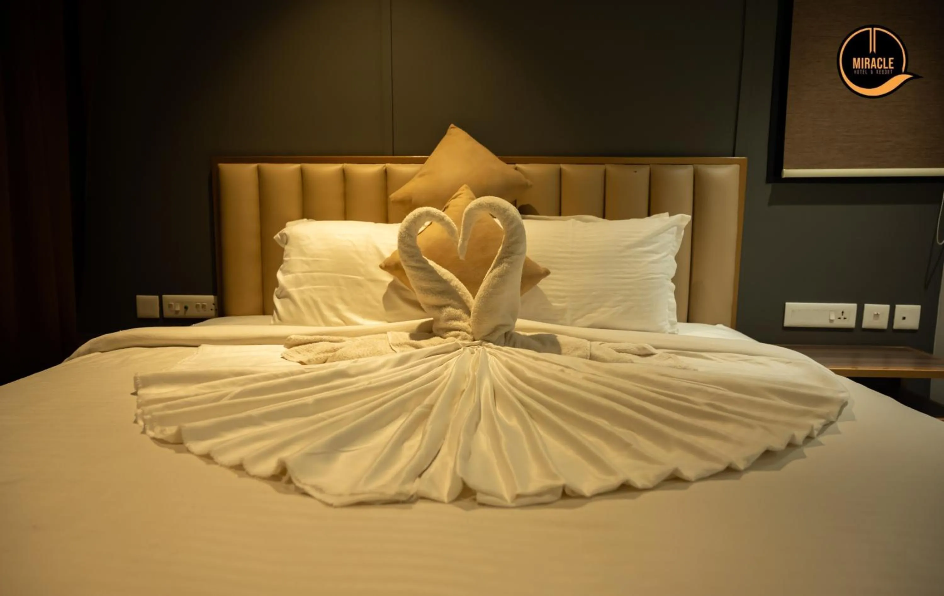 Bed in Miracle Hotel and Resorts