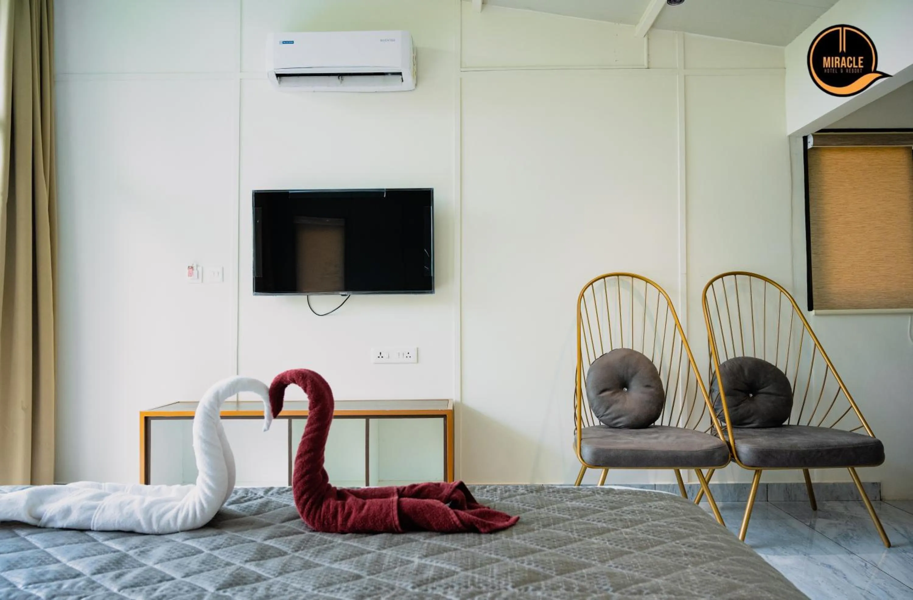 Bed in Miracle Hotel and Resorts