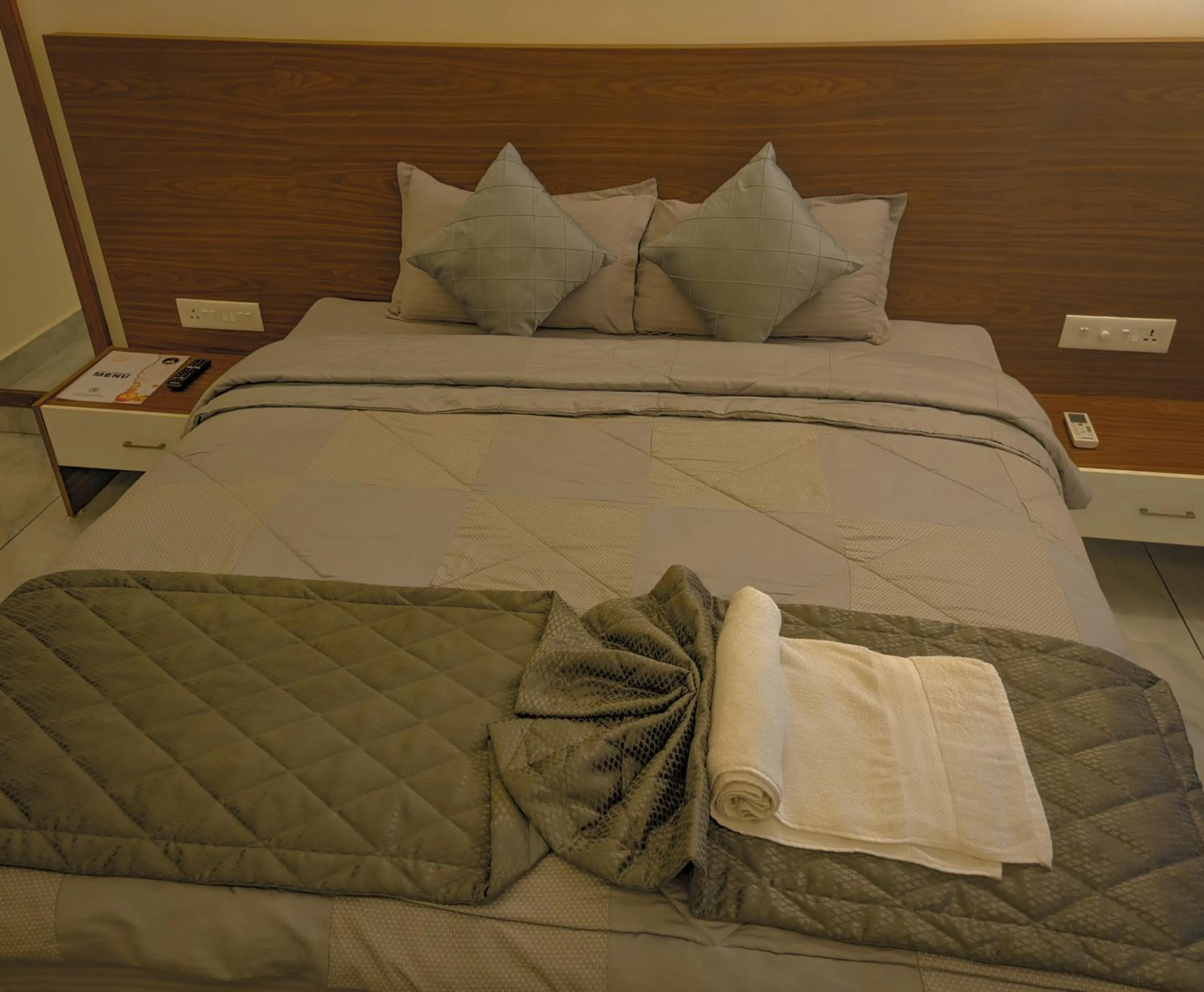 Bed in Miracle Hotel and Resorts