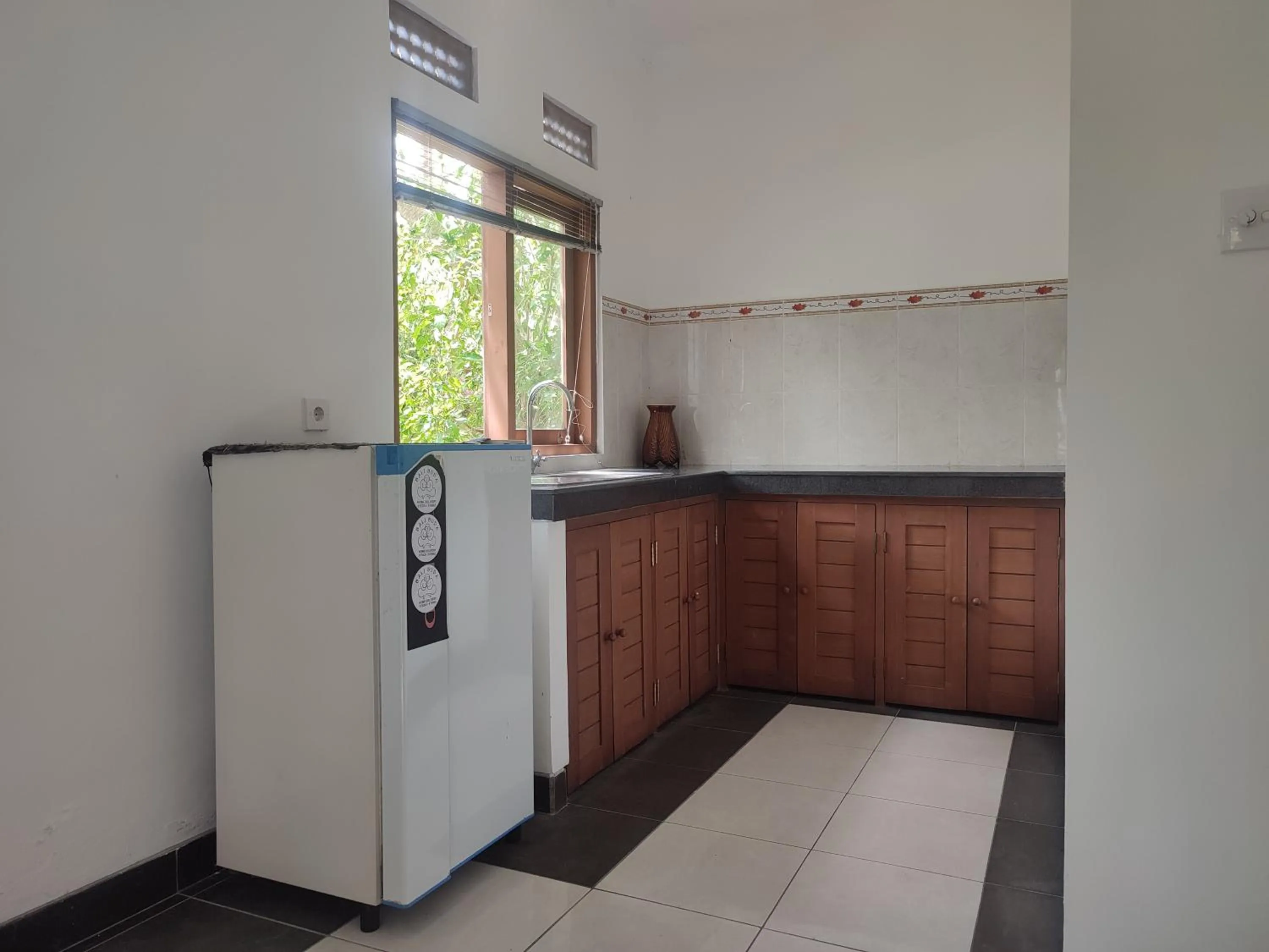 Kitchen or kitchenette in Nyoman Homestay Ubud