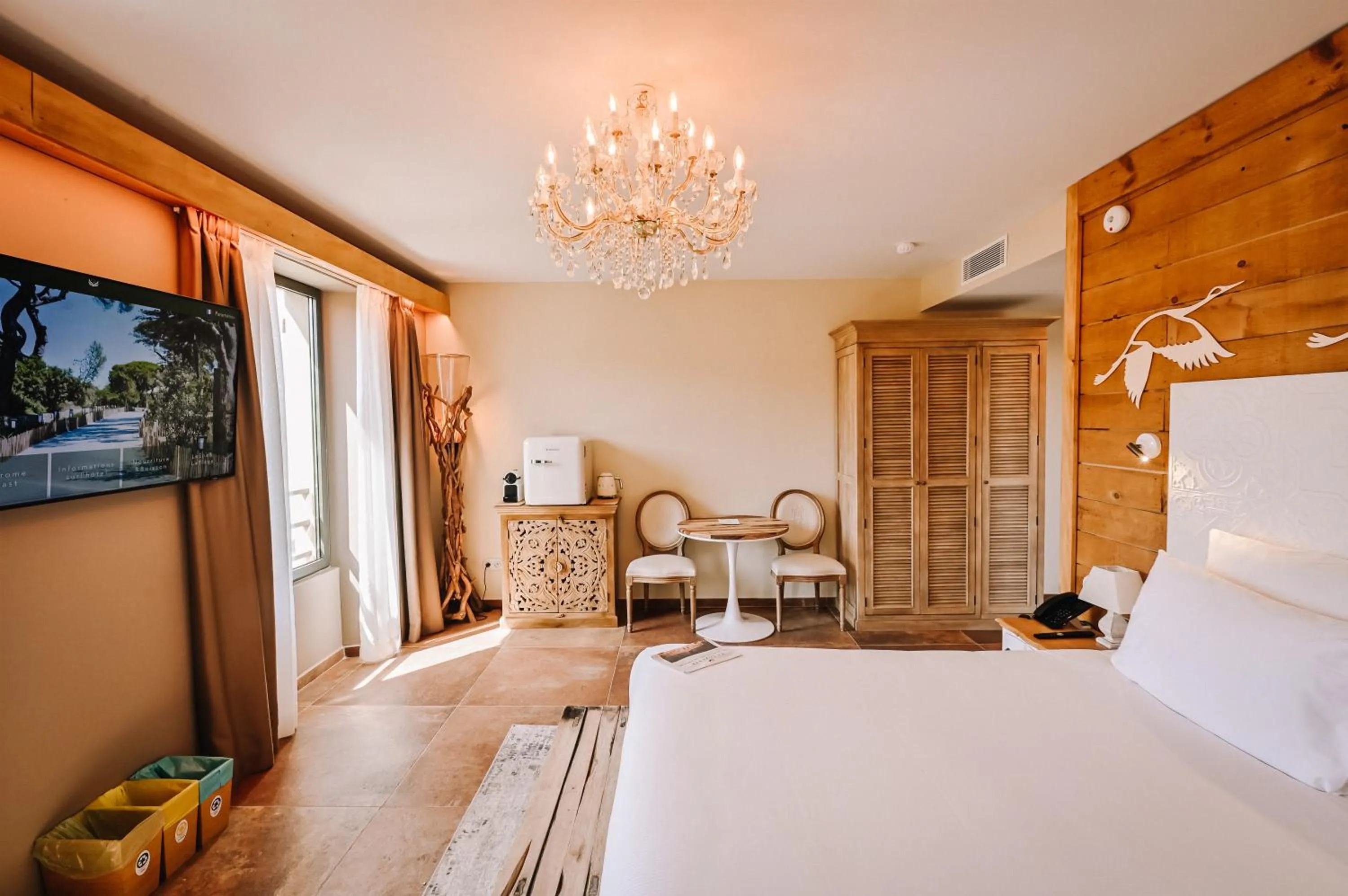 Photo of the whole room, Bed in Le Hameau Des Pesquiers Ecolodge & Spa, Curio Collection By Hilton
