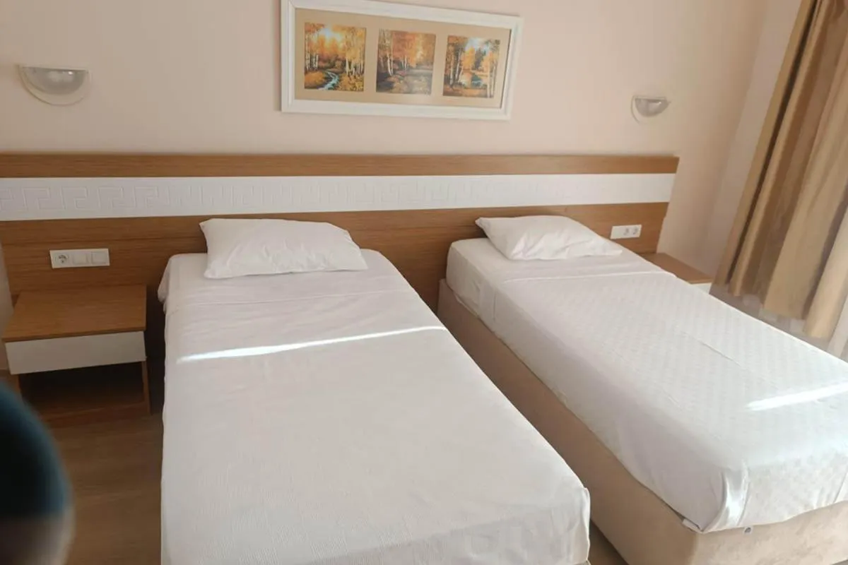 Bed in Alexius Beach Hotel